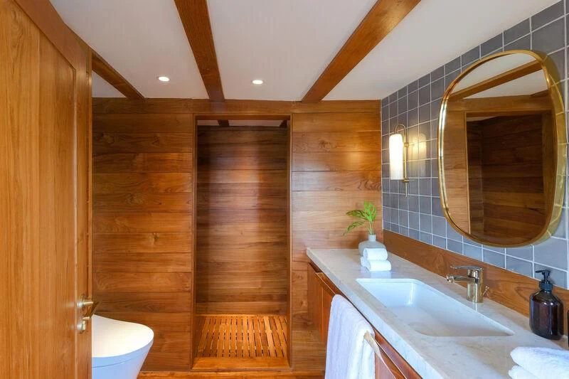 a bathroom with a sink and a mirror aboard CELESTIA Yacht for Sale