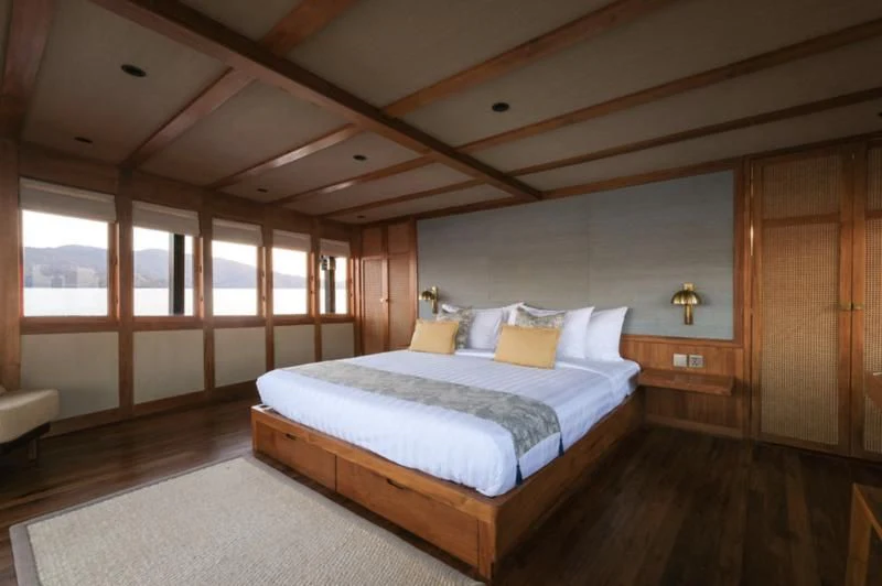 a large bedroom with a large bed aboard CELESTIA Yacht for Sale