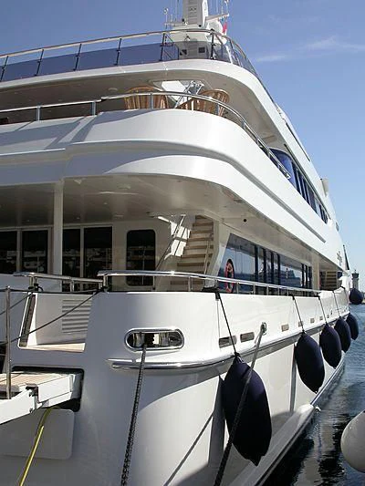 a white yacht with a person on the deck aboard ZENOBIA Yacht for Sale