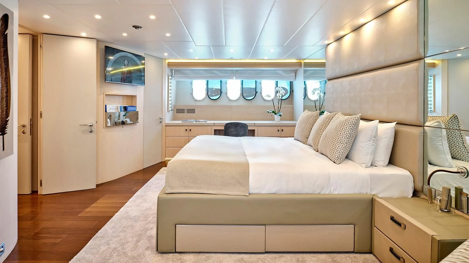 a bedroom with a bed and a mirror aboard WHITE KNIGHT Yacht for Sale