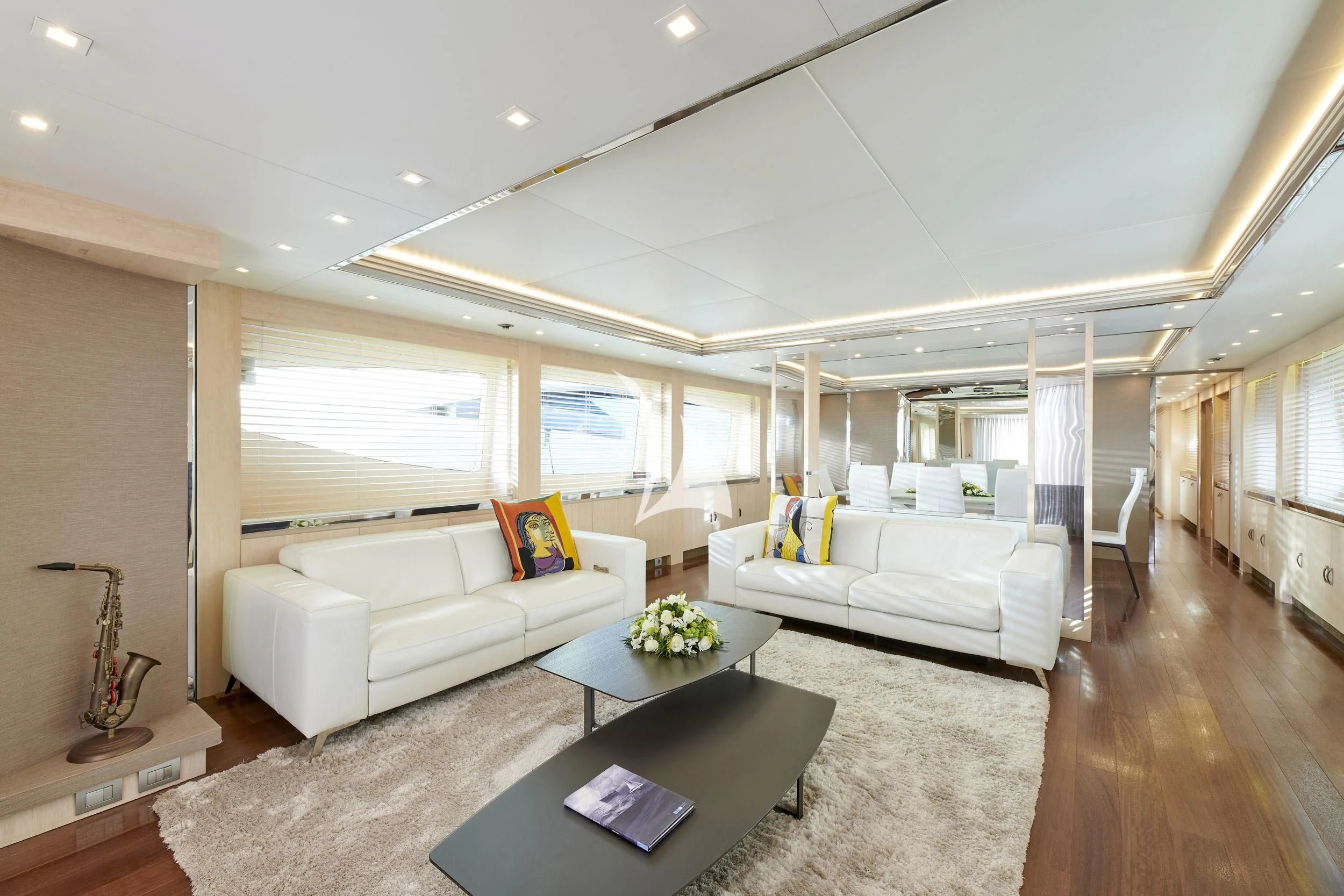 a living room with a couch and a coffee table aboard WHITE KNIGHT Yacht for Sale