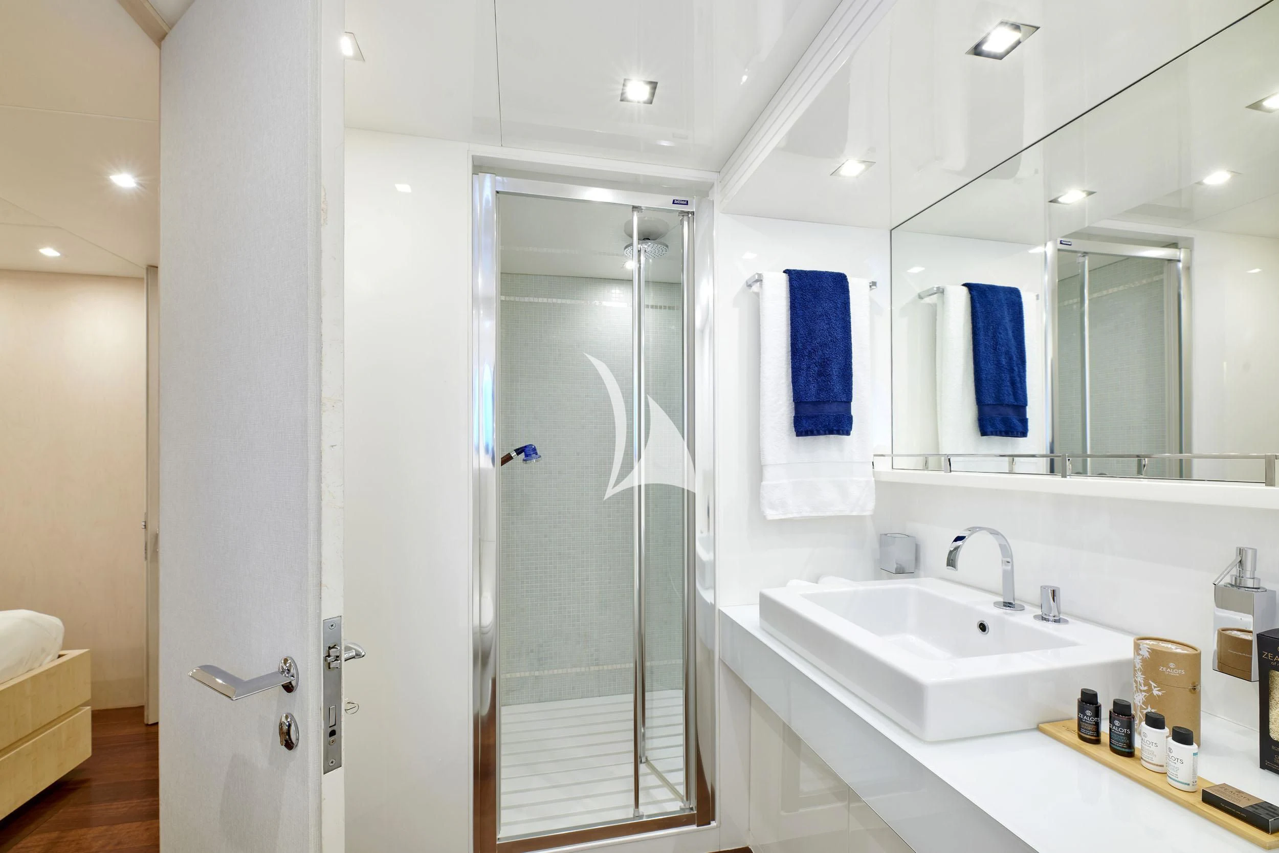 a bathroom with a glass shower aboard WHITE KNIGHT Yacht for Sale