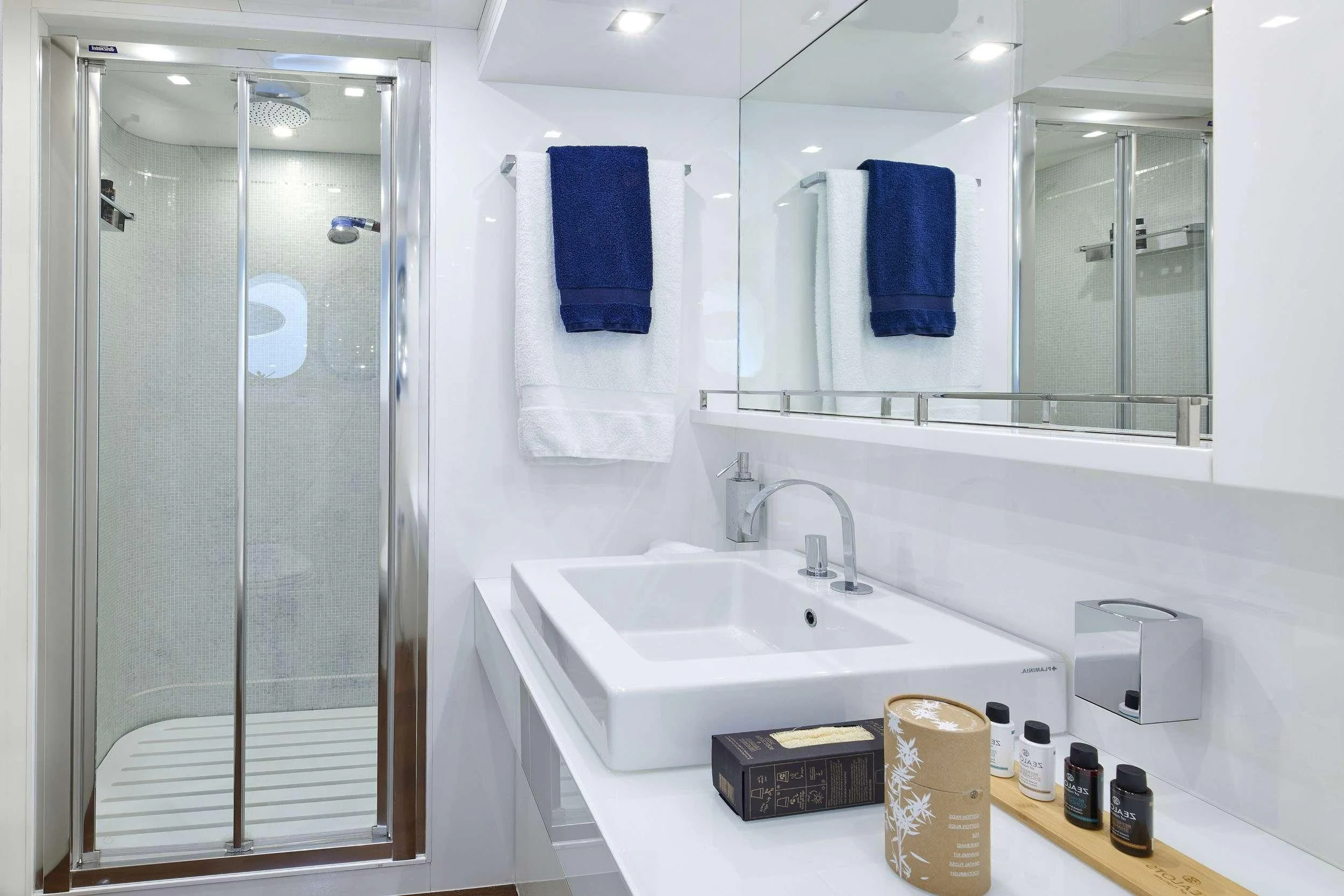 a bathroom with a sink and a mirror aboard WHITE KNIGHT Yacht for Sale