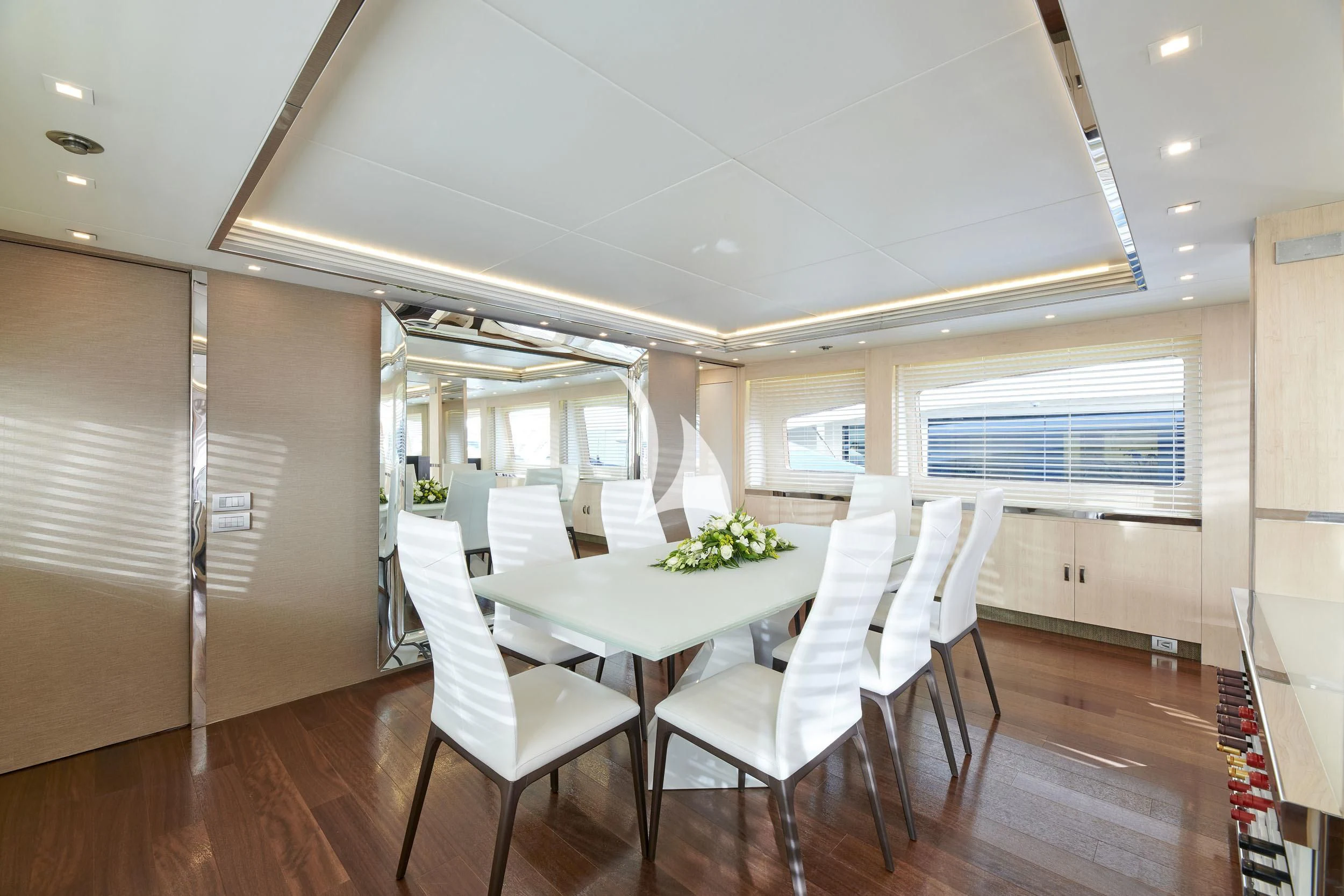 a room with tables and chairs aboard WHITE KNIGHT Yacht for Sale