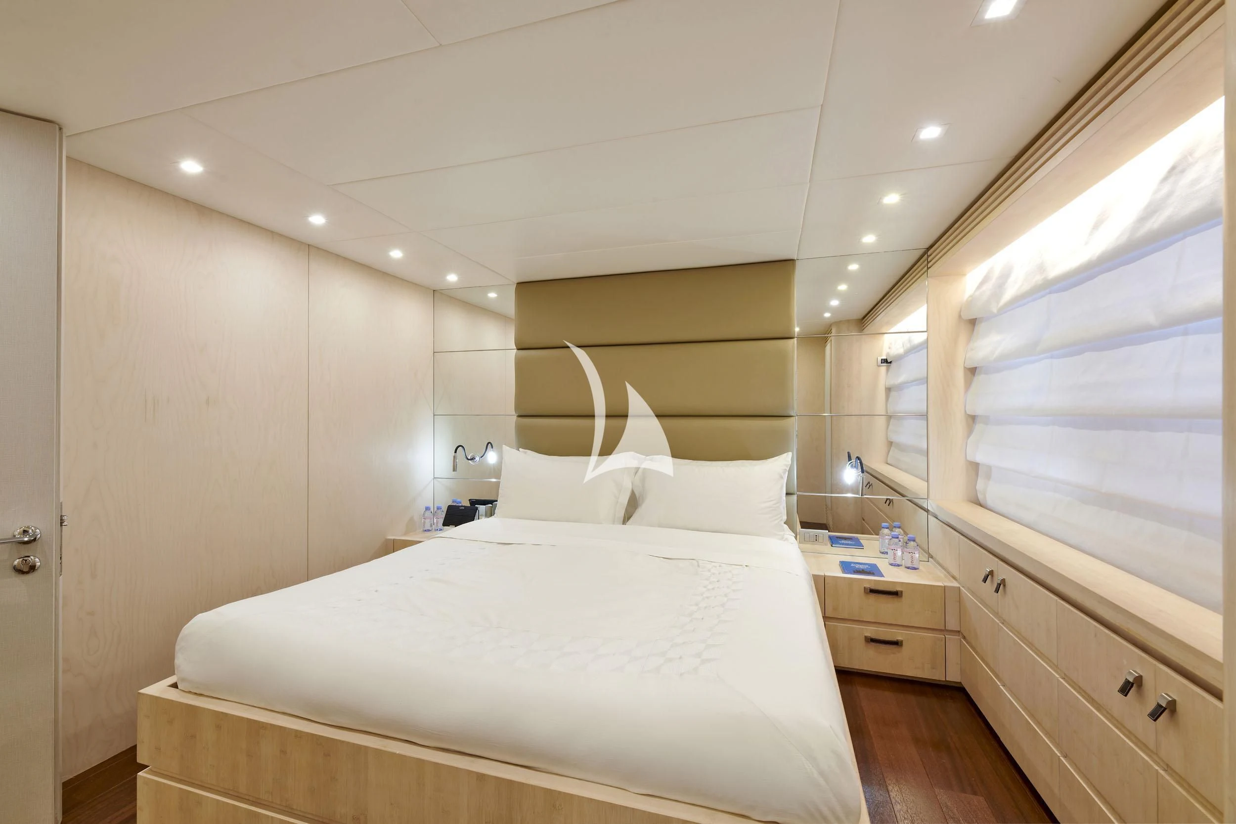 a bedroom with a bed and a window aboard WHITE KNIGHT Yacht for Sale