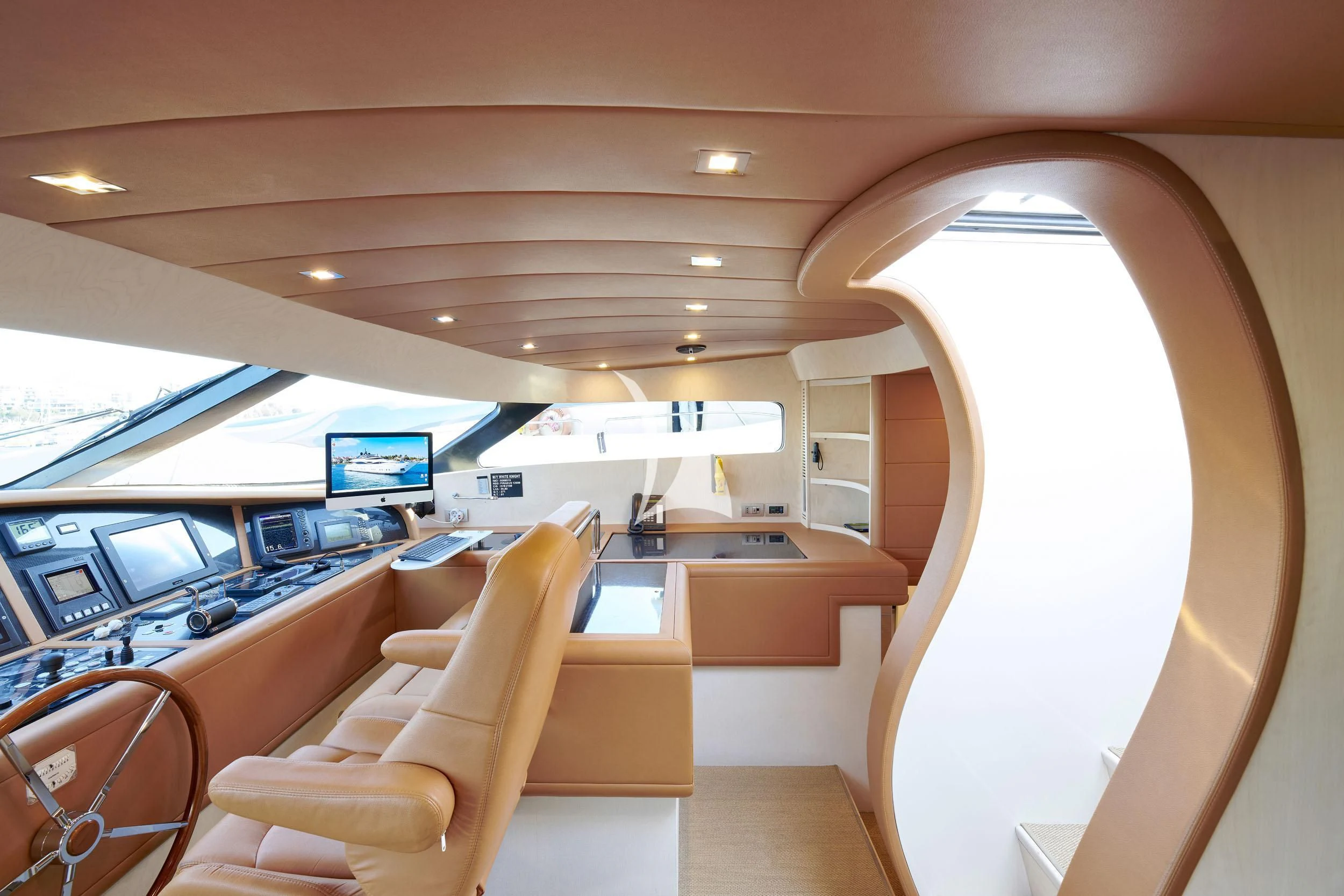 inside of a building with a desk and chairs aboard WHITE KNIGHT Yacht for Sale
