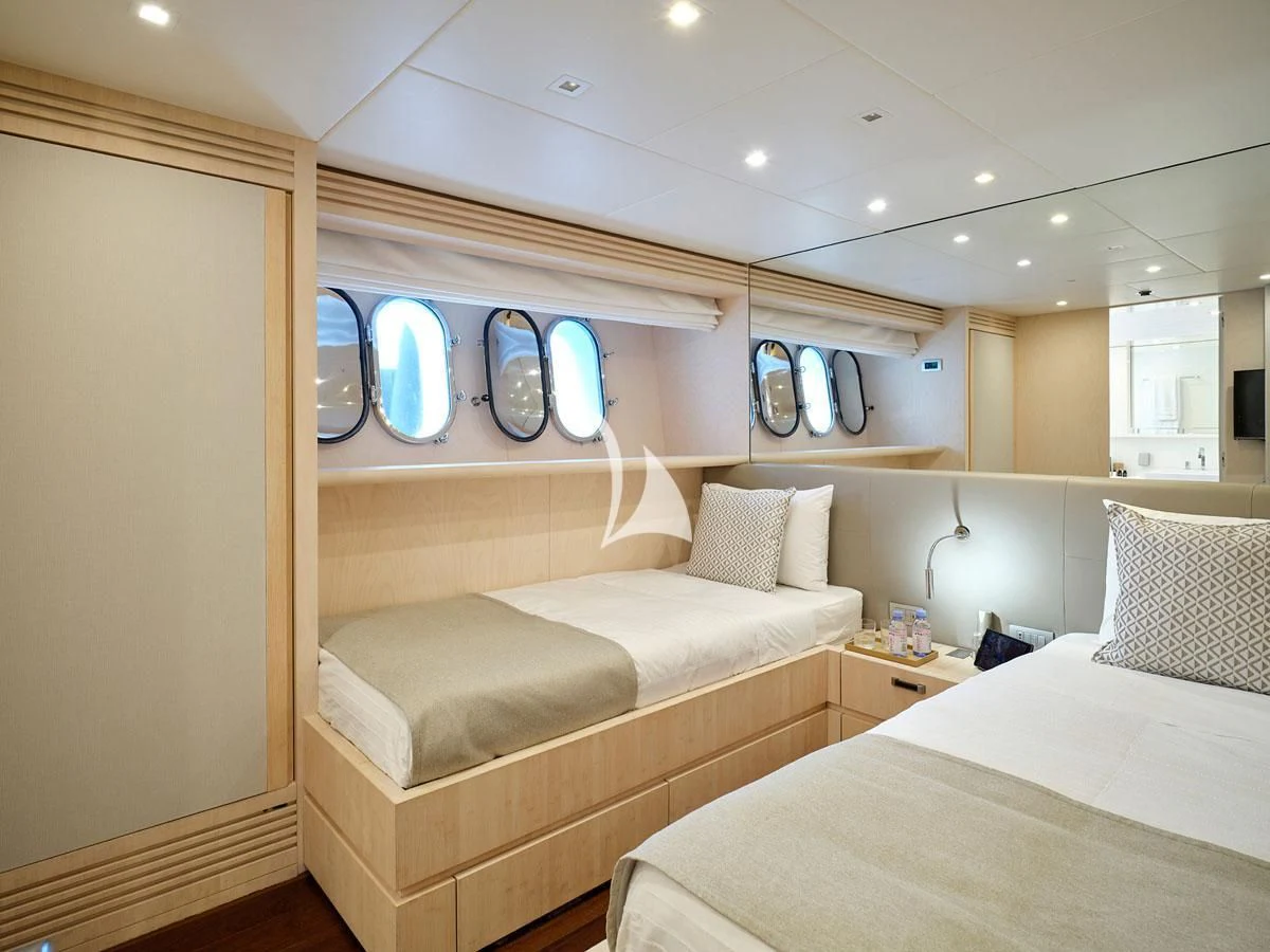 a room with two beds aboard WHITE KNIGHT Yacht for Sale