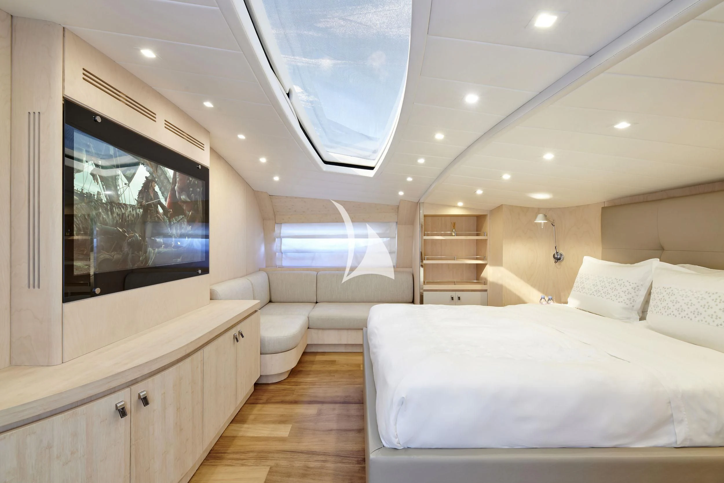 a room with a bed and a tv aboard WHITE KNIGHT Yacht for Sale