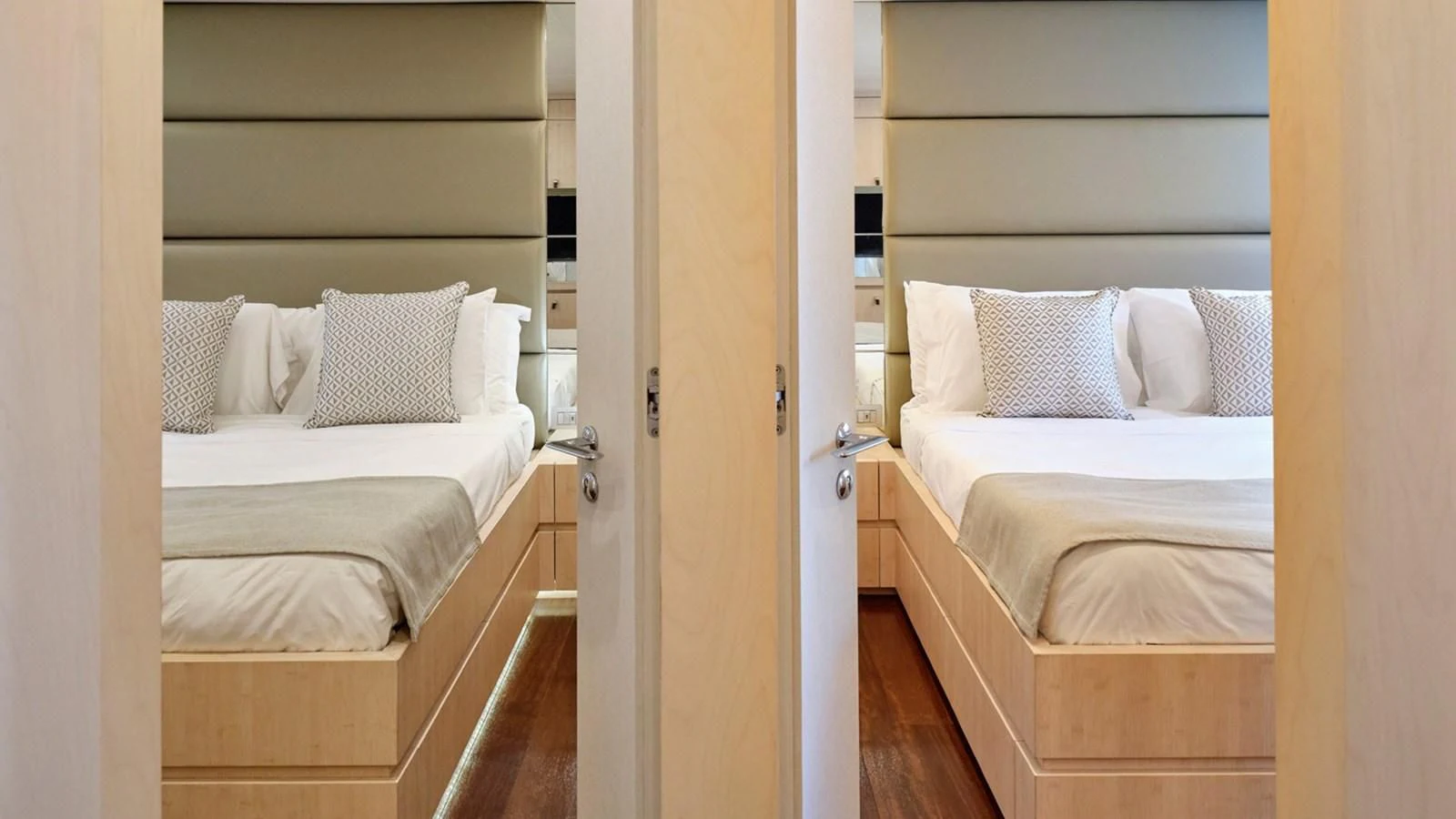 a room with a bed and a door aboard WHITE KNIGHT Yacht for Sale