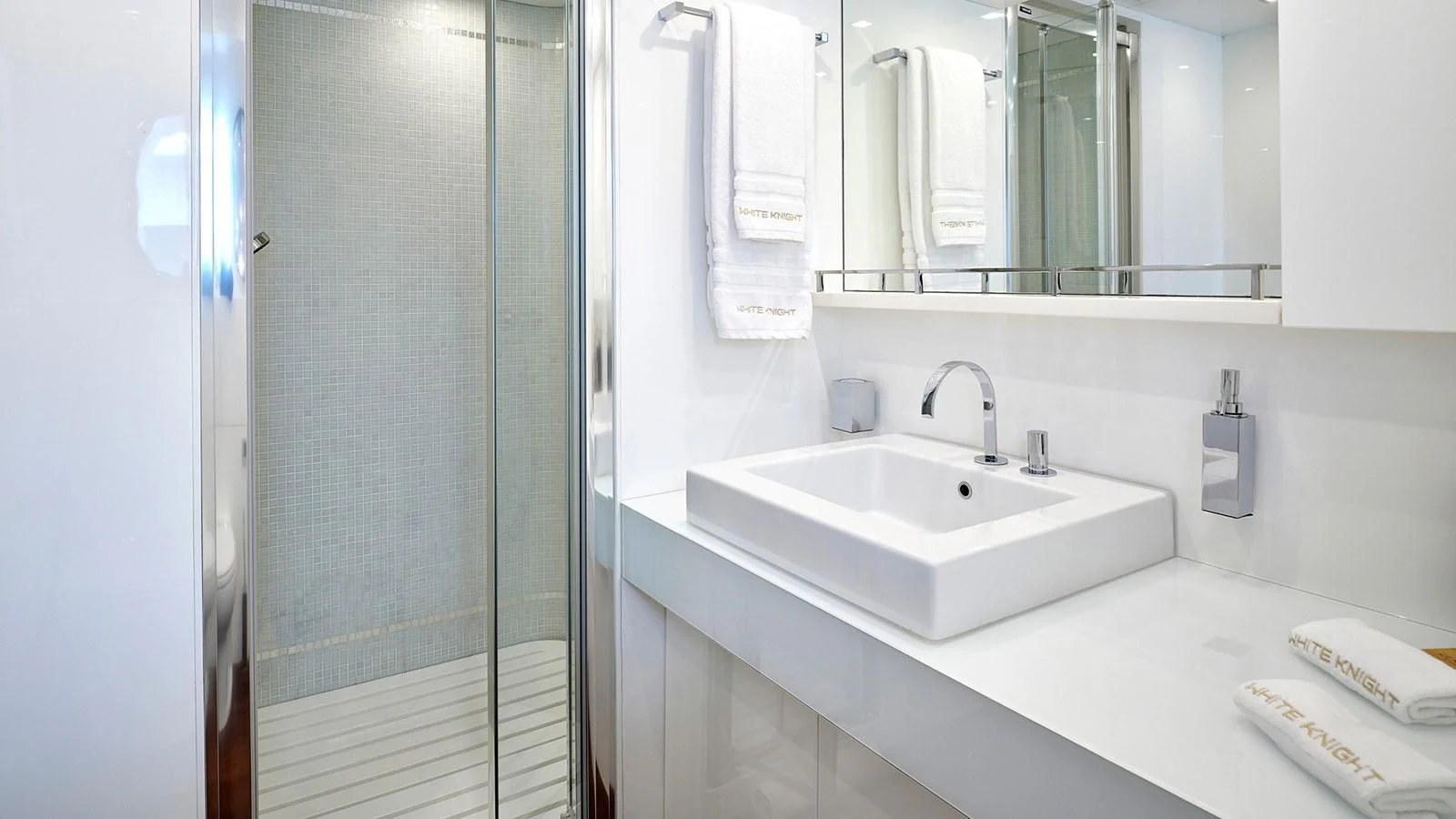 a bathroom with a sink and mirror aboard WHITE KNIGHT Yacht for Sale