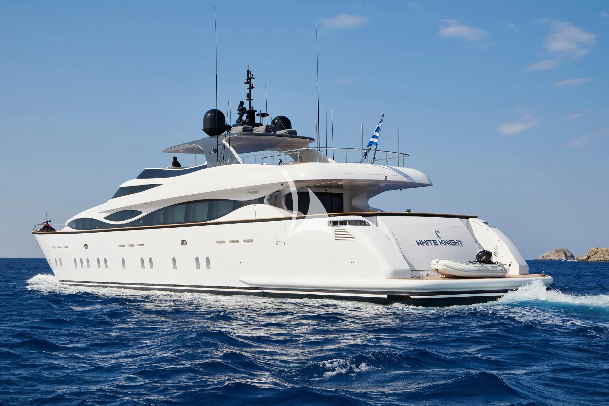 a white yacht on the water aboard WHITE KNIGHT Yacht for Sale