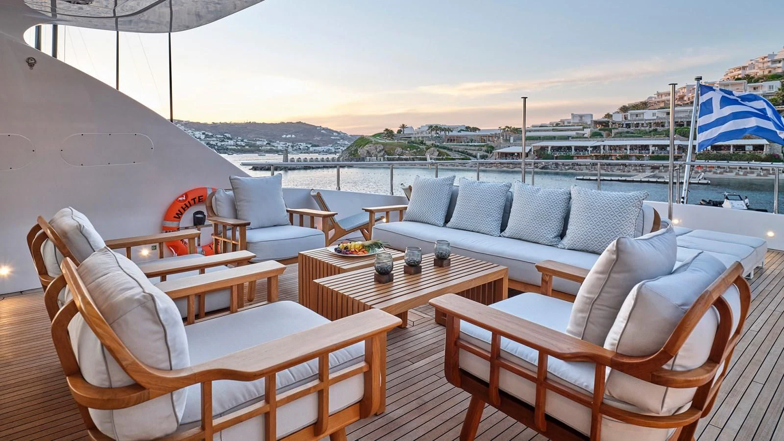 a patio with a table and chairs aboard WHITE KNIGHT Yacht for Sale