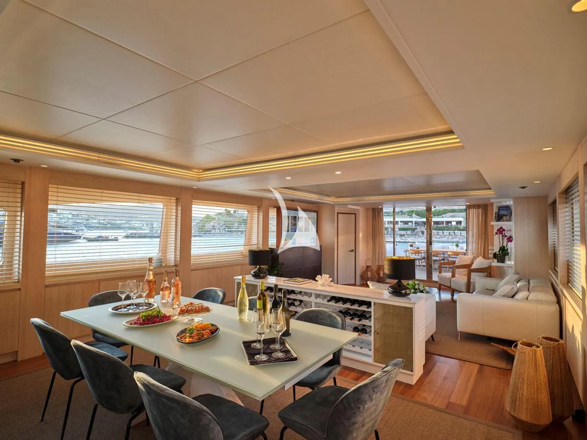 a dining room with a large table aboard WHITE KNIGHT Yacht for Sale