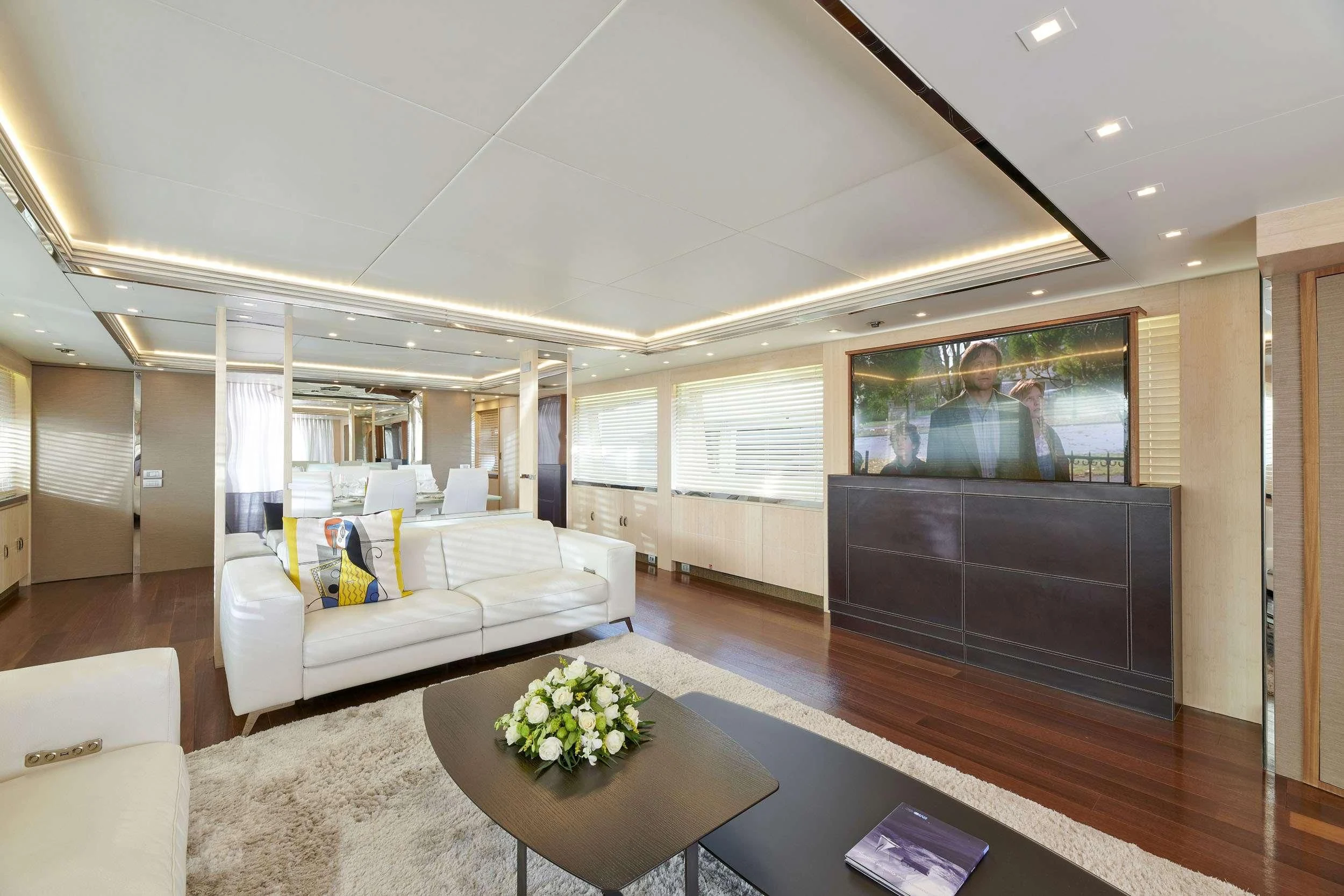a living room with a large screen aboard WHITE KNIGHT Yacht for Sale
