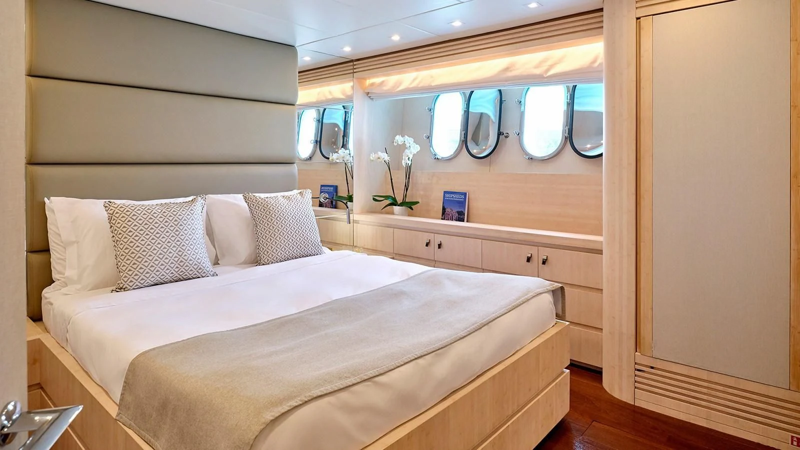 a bed with white sheets and pillows aboard WHITE KNIGHT Yacht for Sale