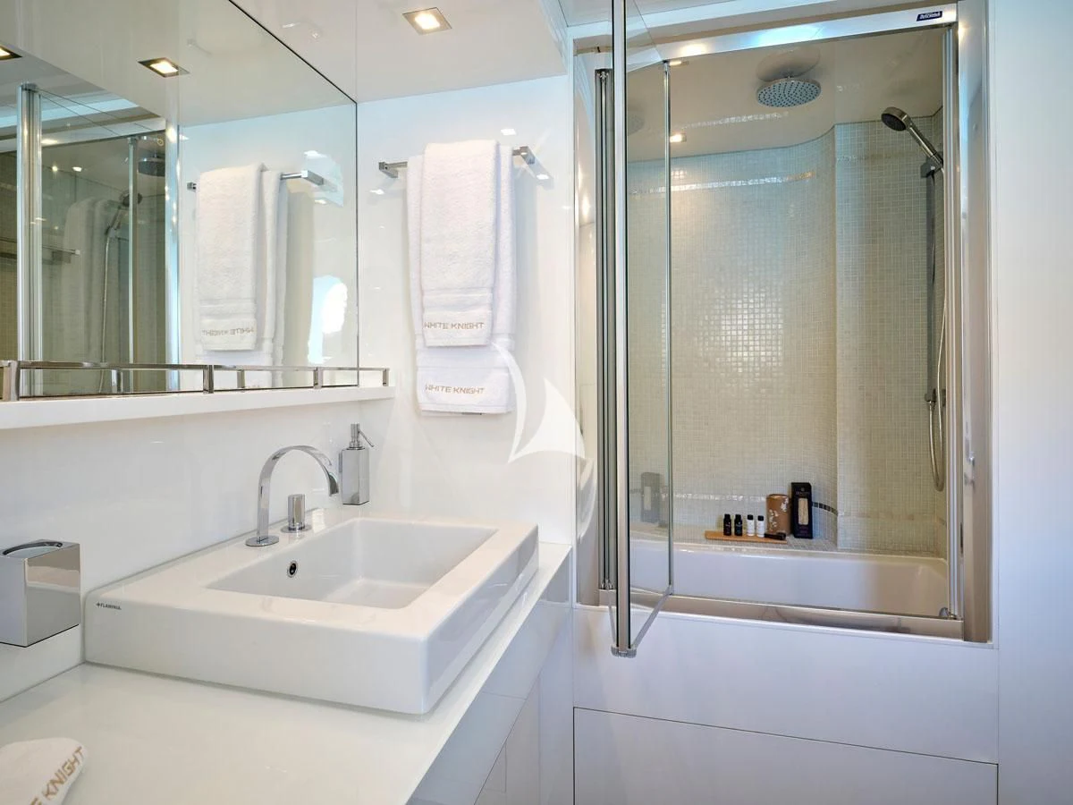 a bathroom with a glass shower aboard WHITE KNIGHT Yacht for Sale