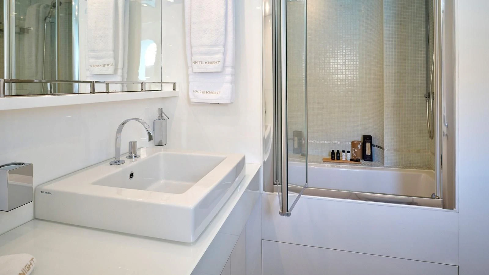 a bathroom with a sink and a mirror aboard WHITE KNIGHT Yacht for Sale