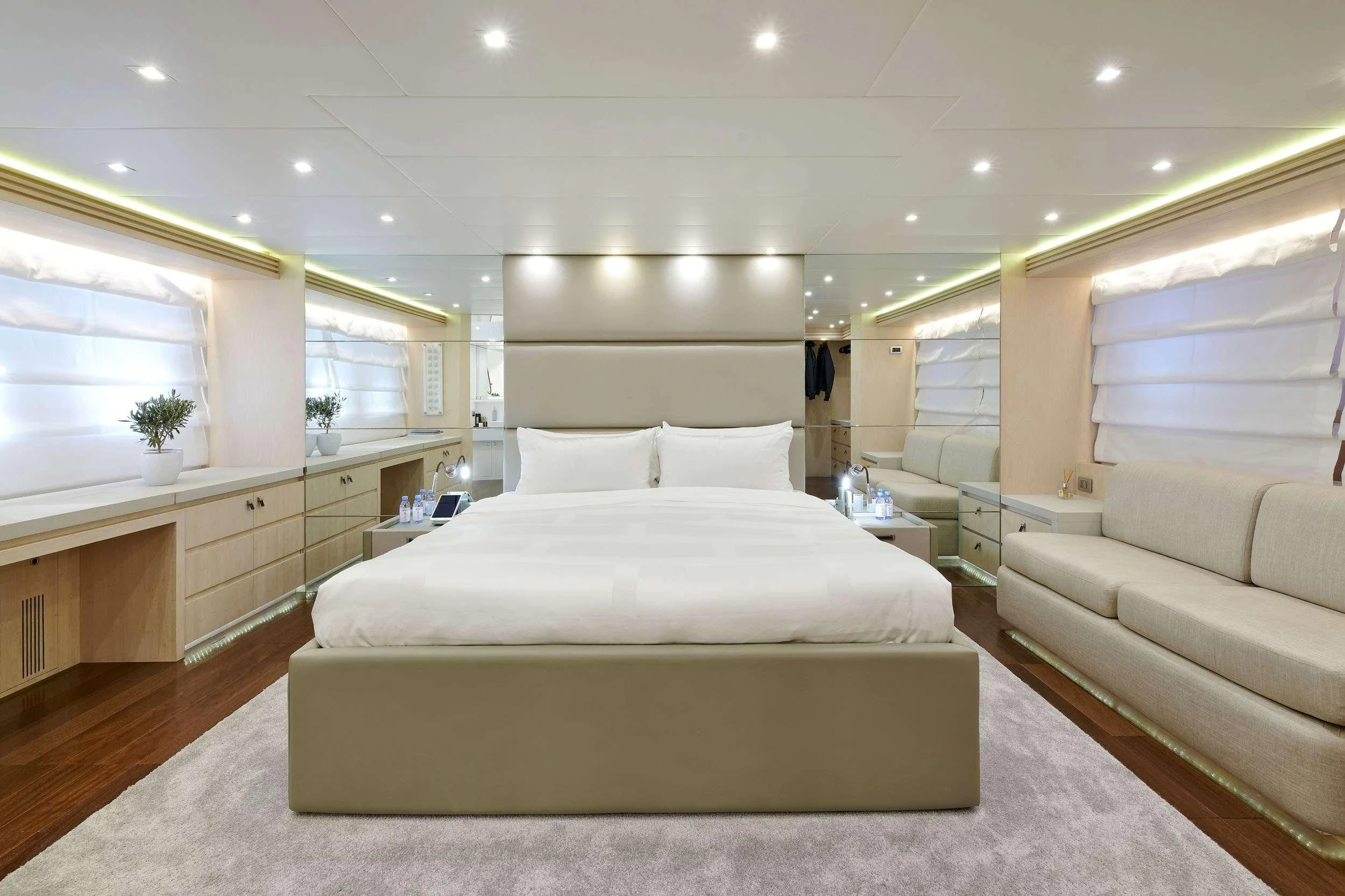 a room with a bed and a couch aboard WHITE KNIGHT Yacht for Sale