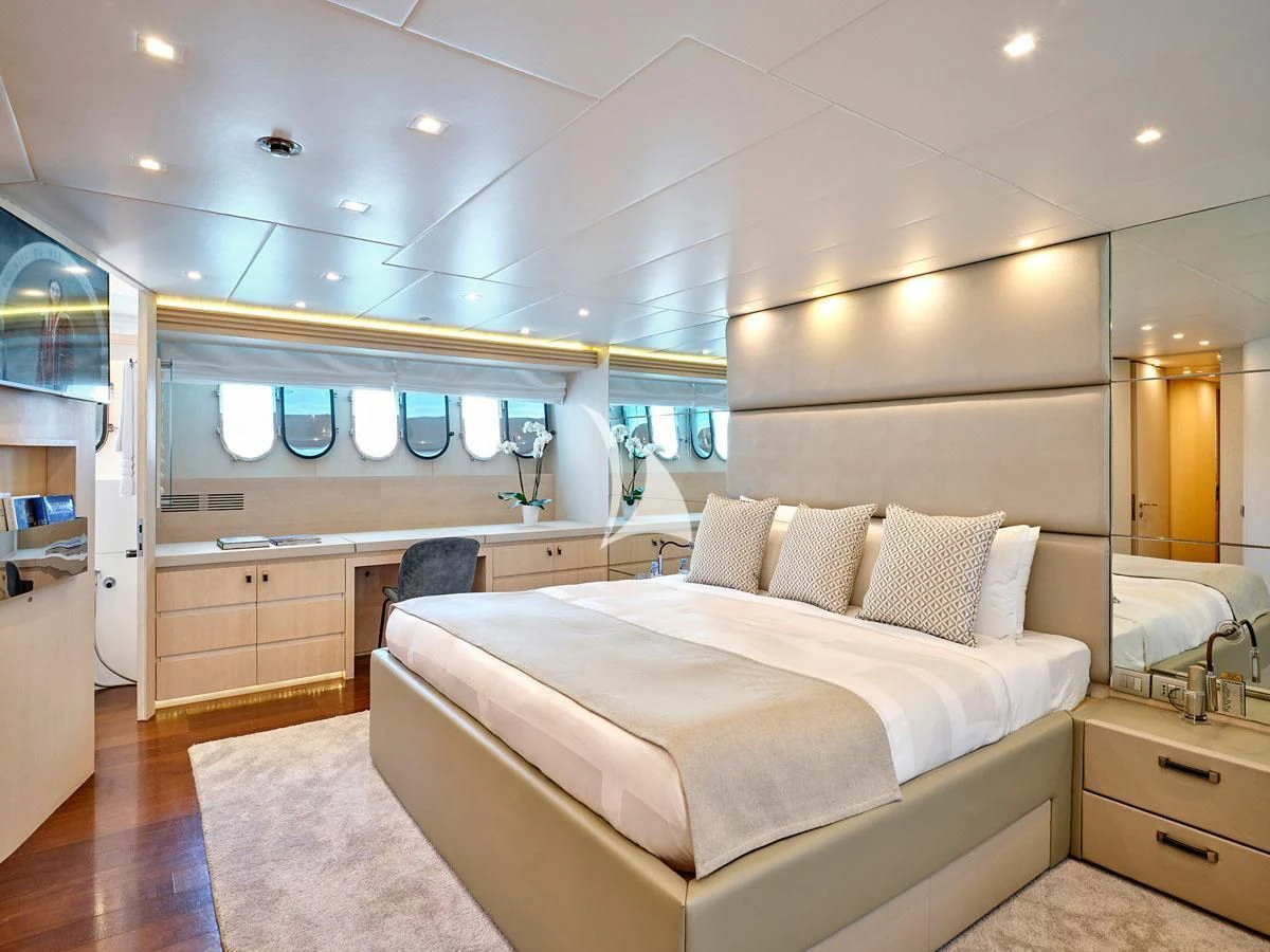 a modern looking bedroom aboard WHITE KNIGHT Yacht for Sale
