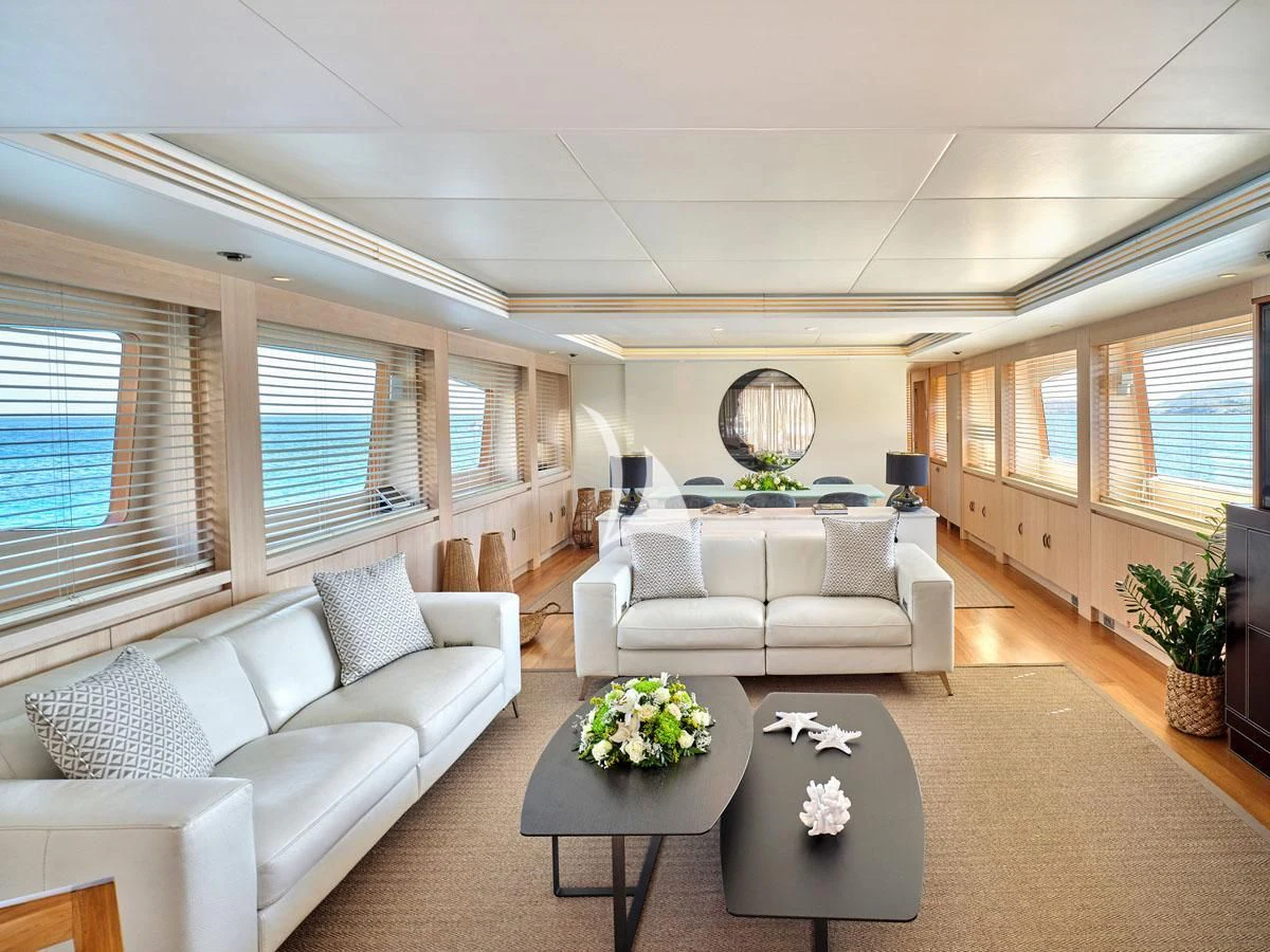 a living room with a couch and a coffee table aboard WHITE KNIGHT Yacht for Sale
