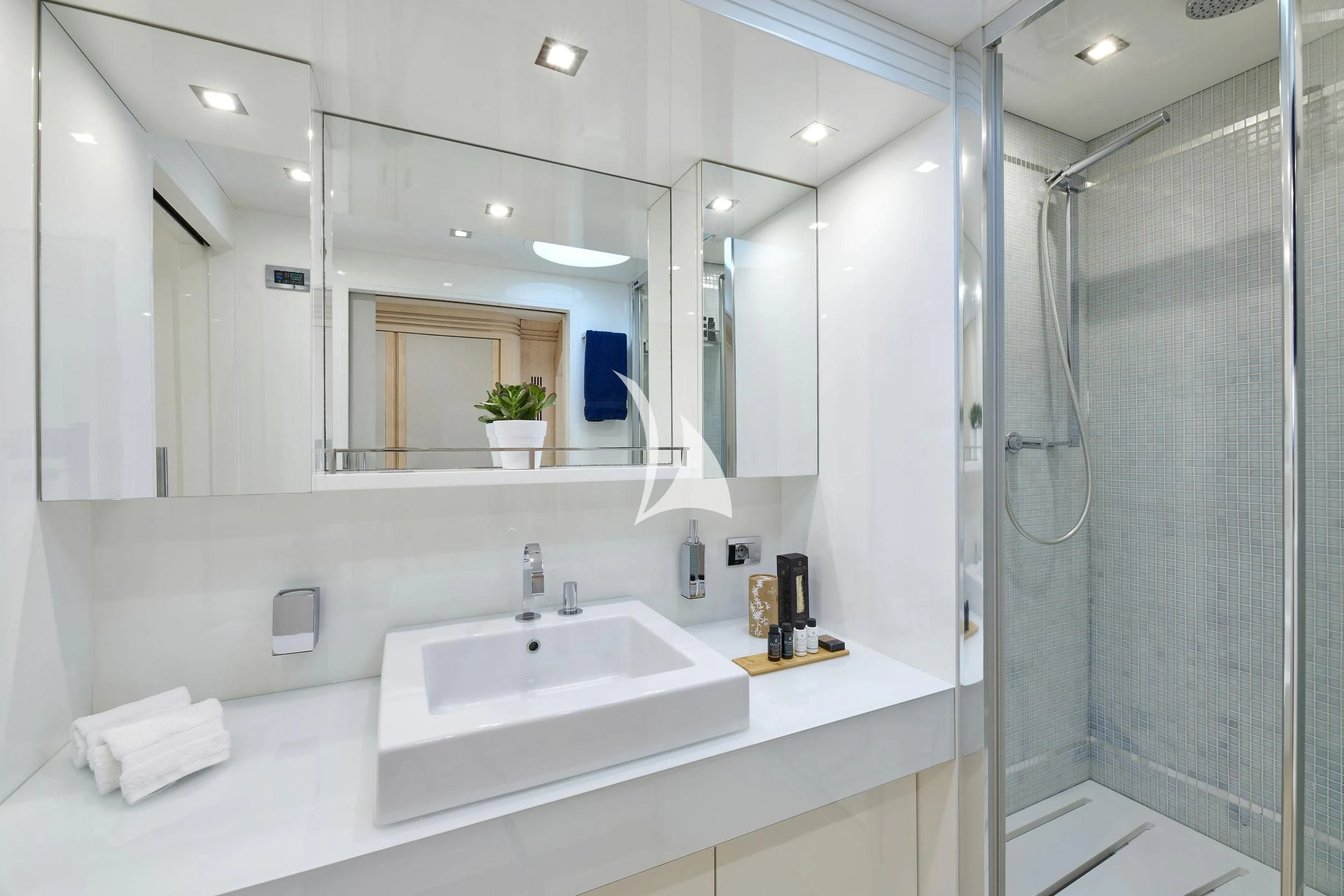 a bathroom with a large mirror aboard WHITE KNIGHT Yacht for Sale
