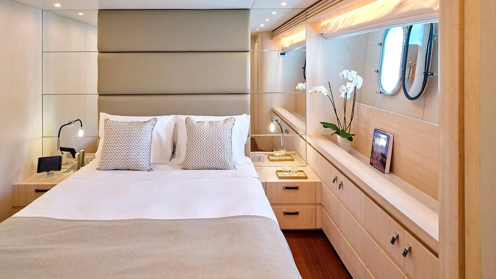 a bed with white sheets and pillows aboard WHITE KNIGHT Yacht for Sale