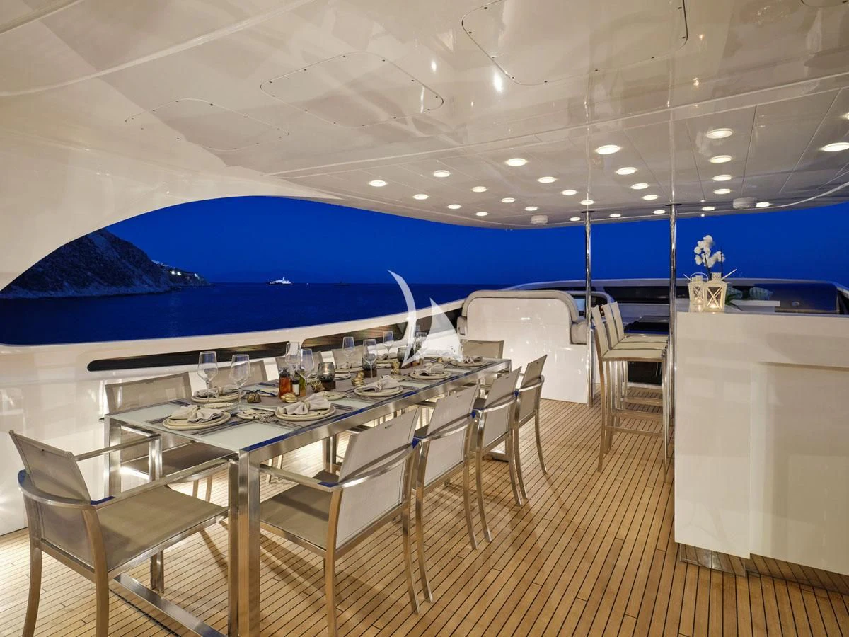 a large room with a table and chairs aboard WHITE KNIGHT Yacht for Sale