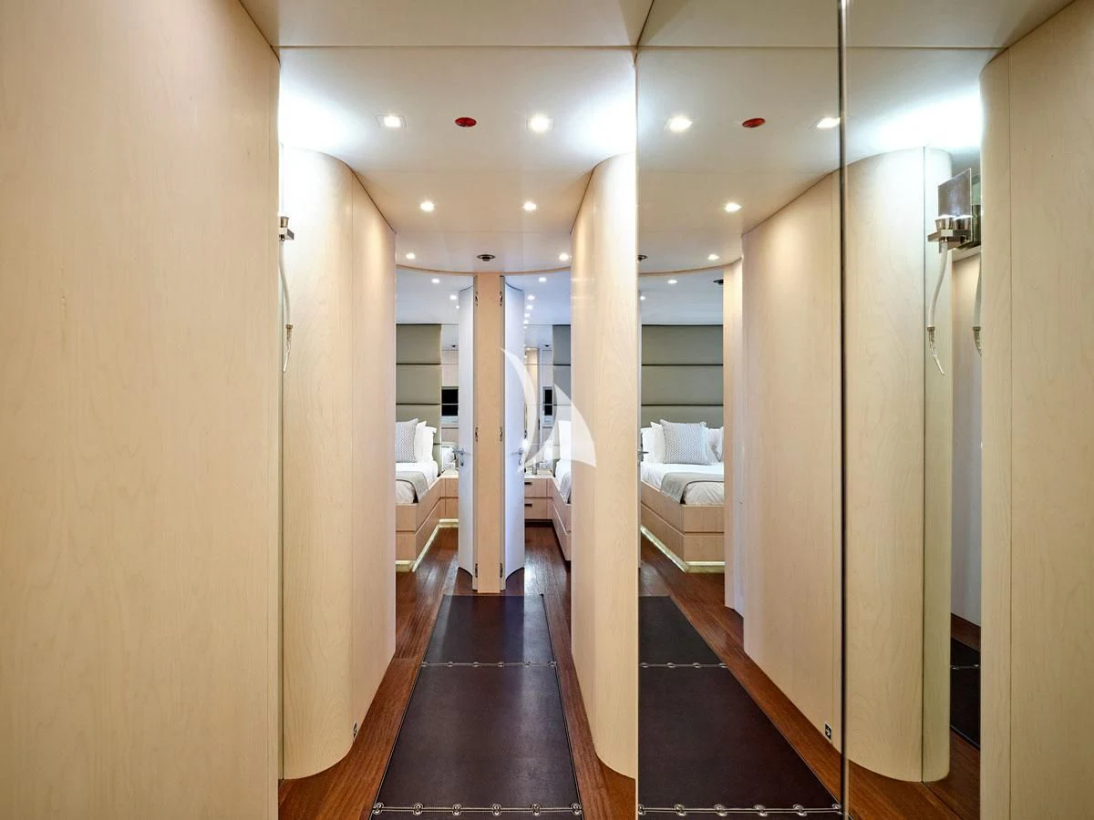 a hallway with a wood floor and white walls aboard WHITE KNIGHT Yacht for Sale