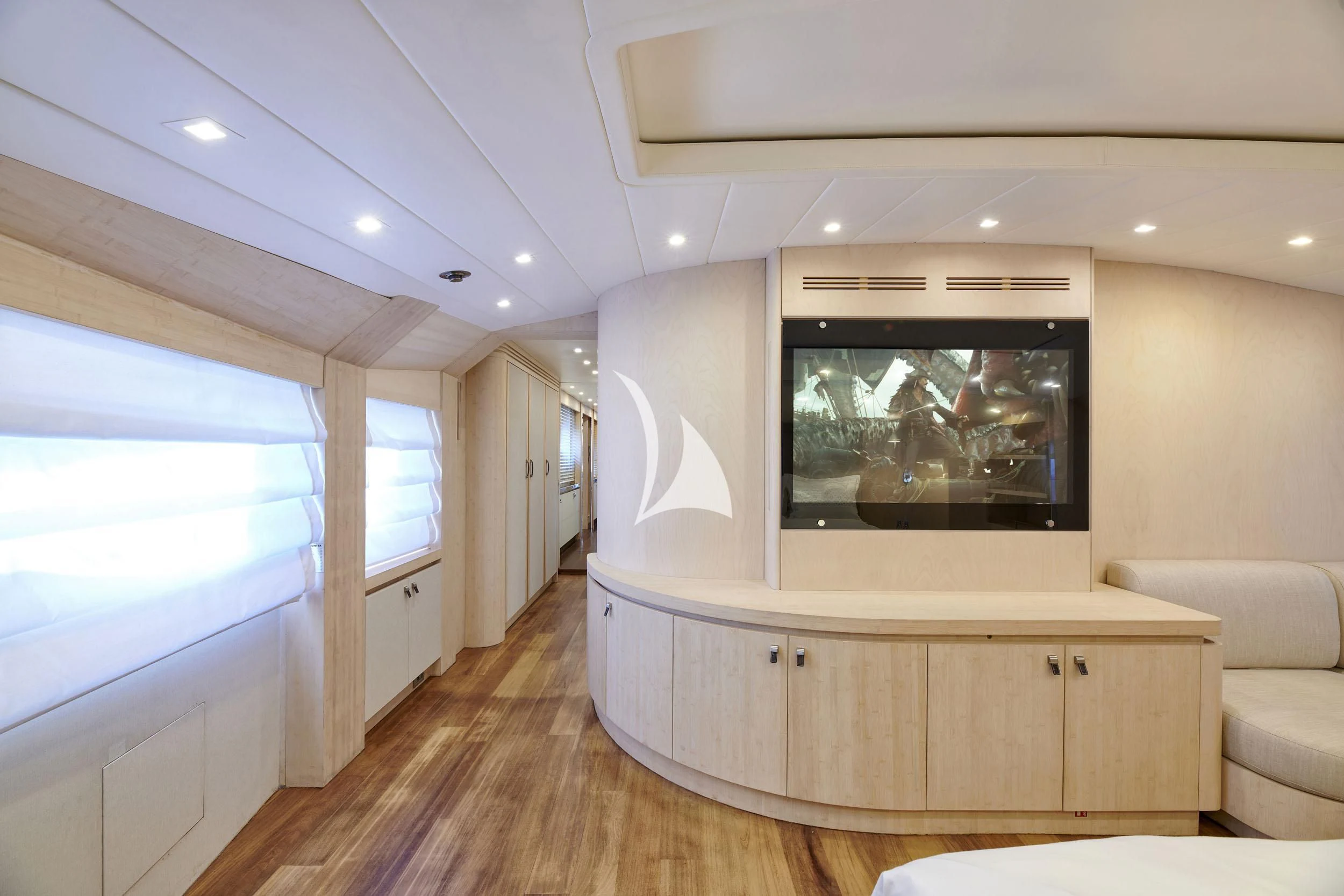 a room with a tv and a couch aboard WHITE KNIGHT Yacht for Sale
