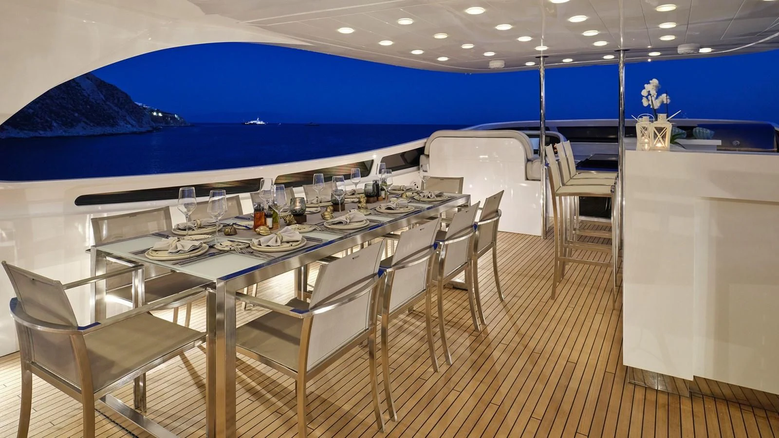 a large room with a table and chairs aboard WHITE KNIGHT Yacht for Sale