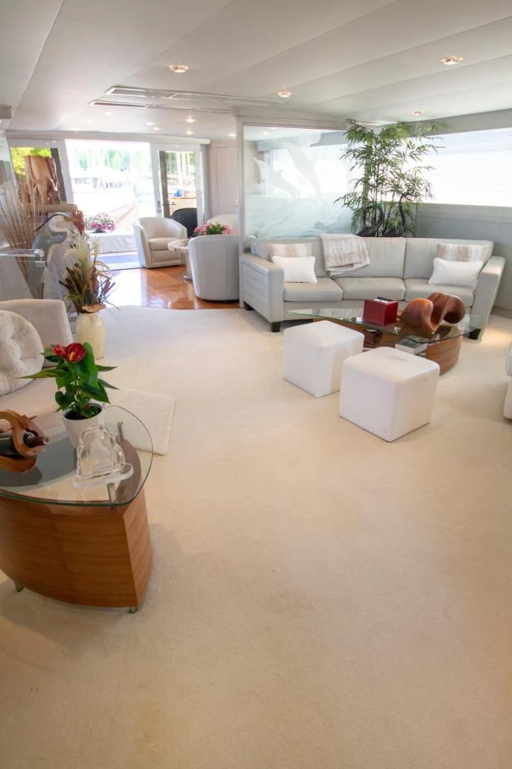 a living room with a large window aboard LIQUIDITY Yacht for Sale