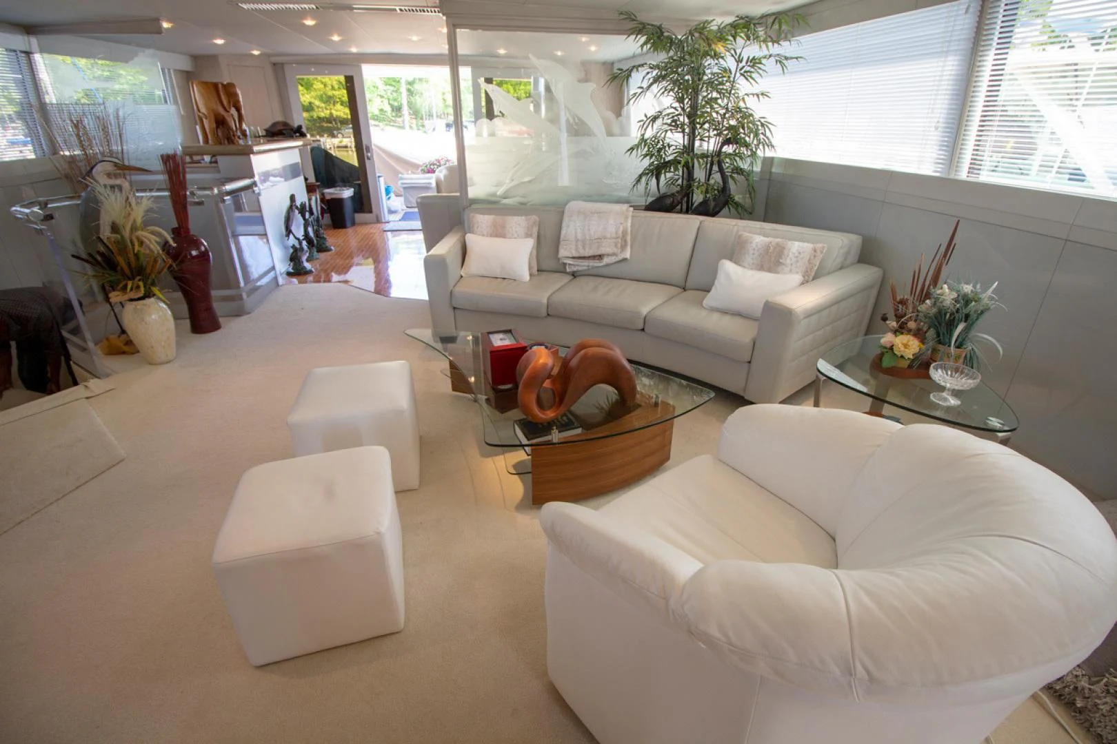 a living room with a couch and a coffee table aboard LIQUIDITY Yacht for Sale