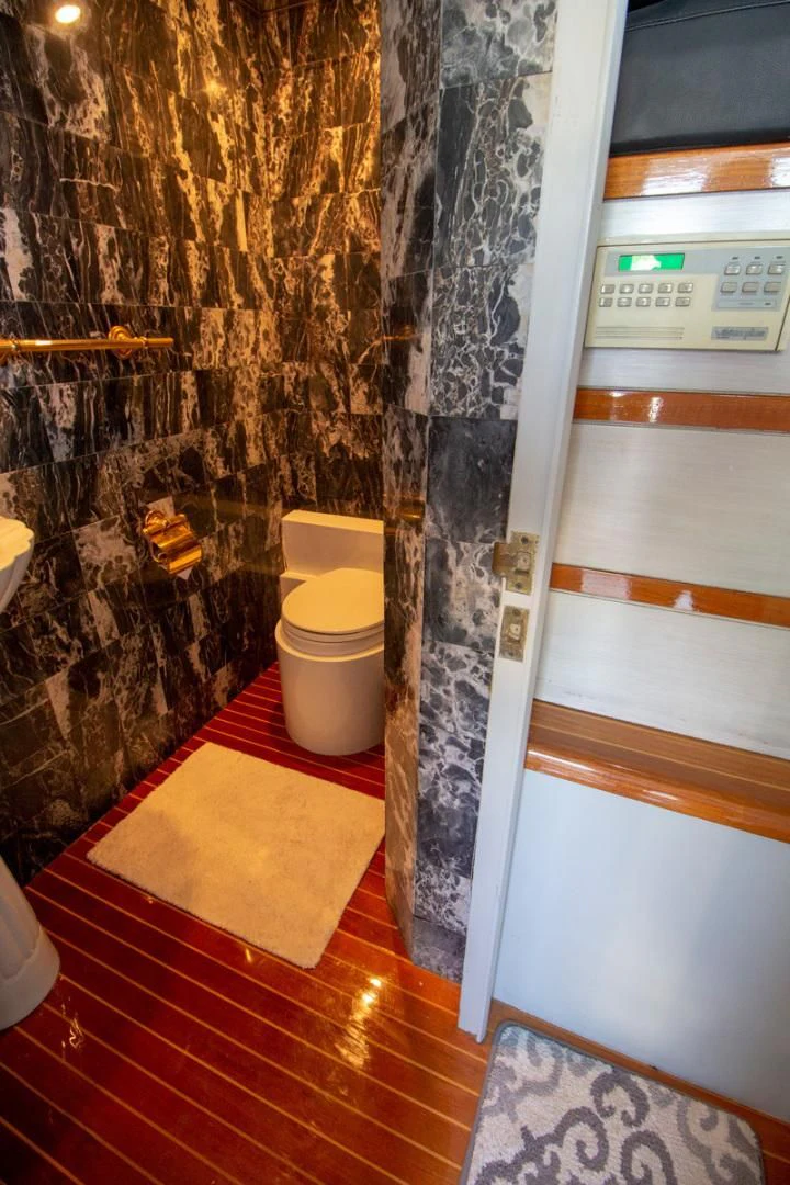 a bathroom with a shower aboard LIQUIDITY Yacht for Sale