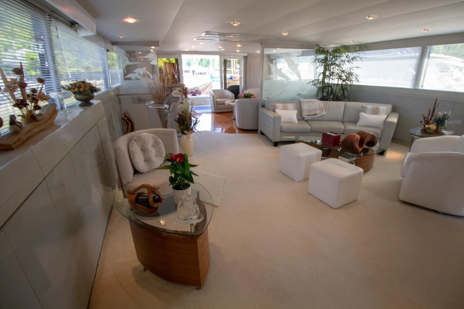 a living room with a large window aboard LIQUIDITY Yacht for Sale