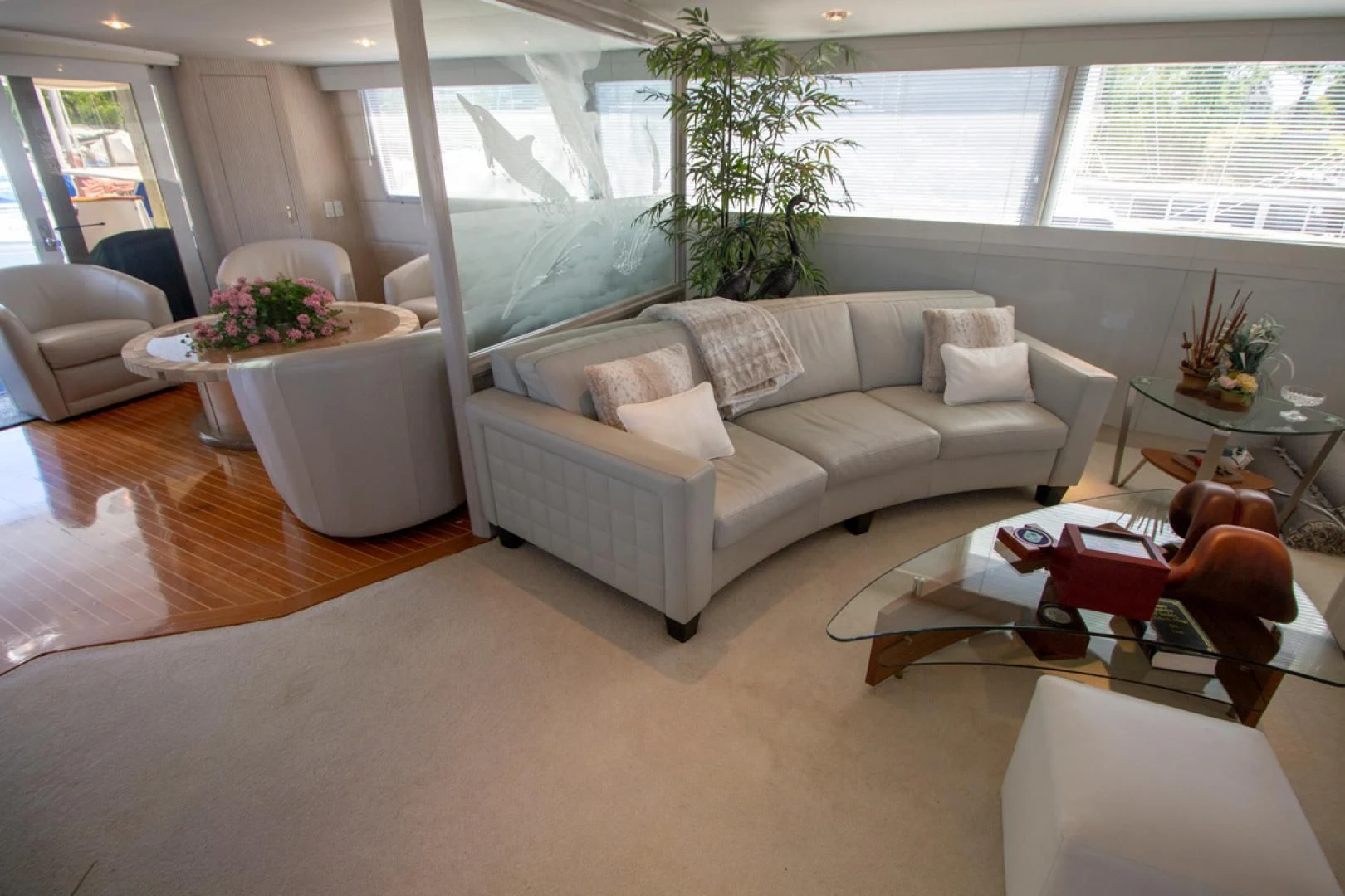 a living room with a couch and a table aboard LIQUIDITY Yacht for Sale
