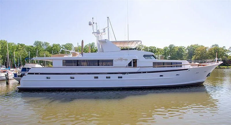 a large white boat on the water aboard LIQUIDITY Yacht for Sale