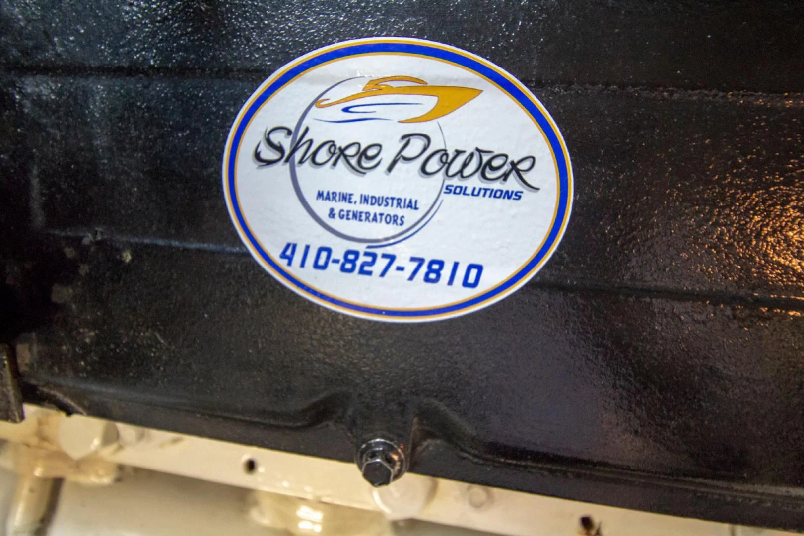 a logo on a metal surface aboard LIQUIDITY Yacht for Sale