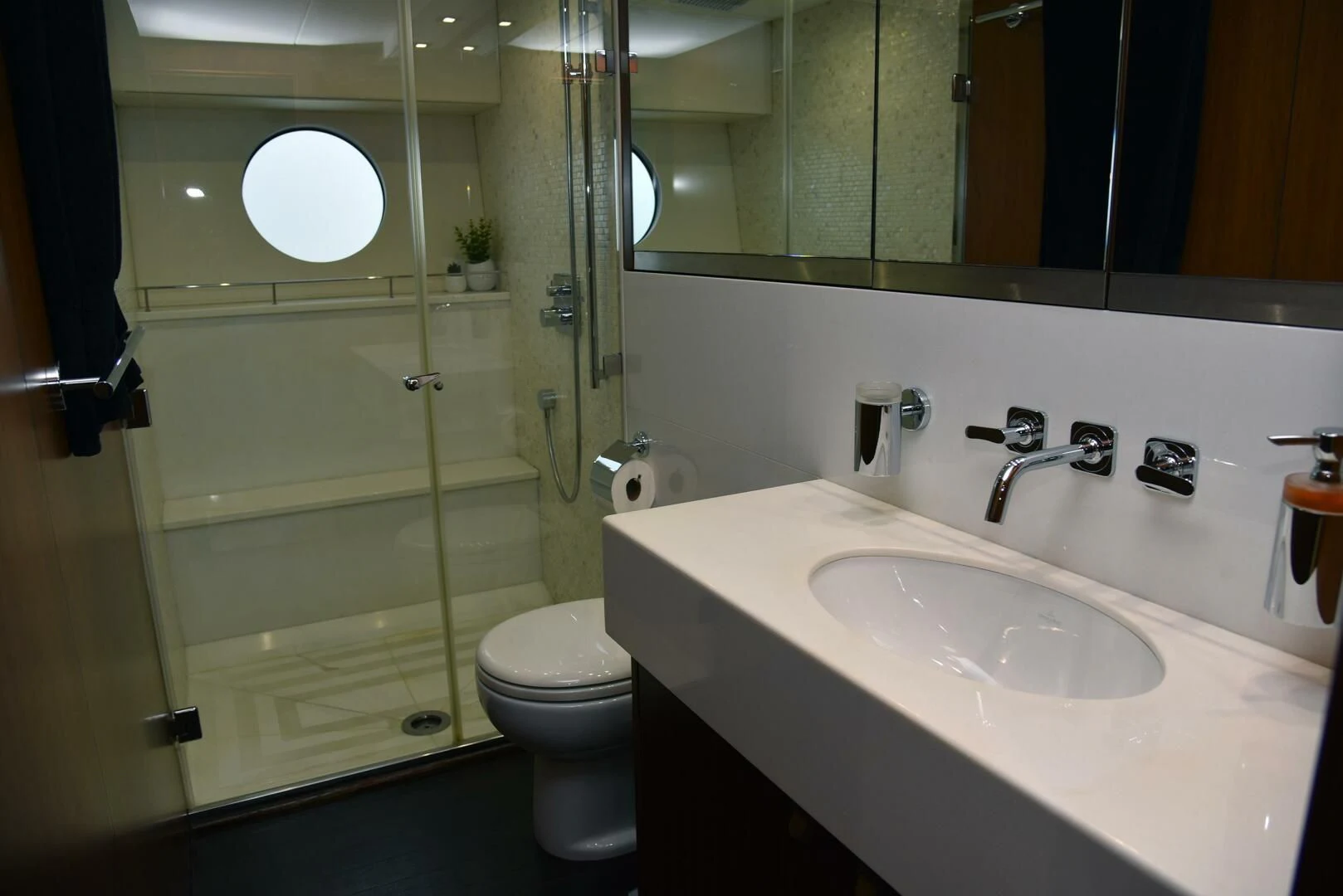 a bathroom with a glass shower door aboard SAVI II Yacht for Sale