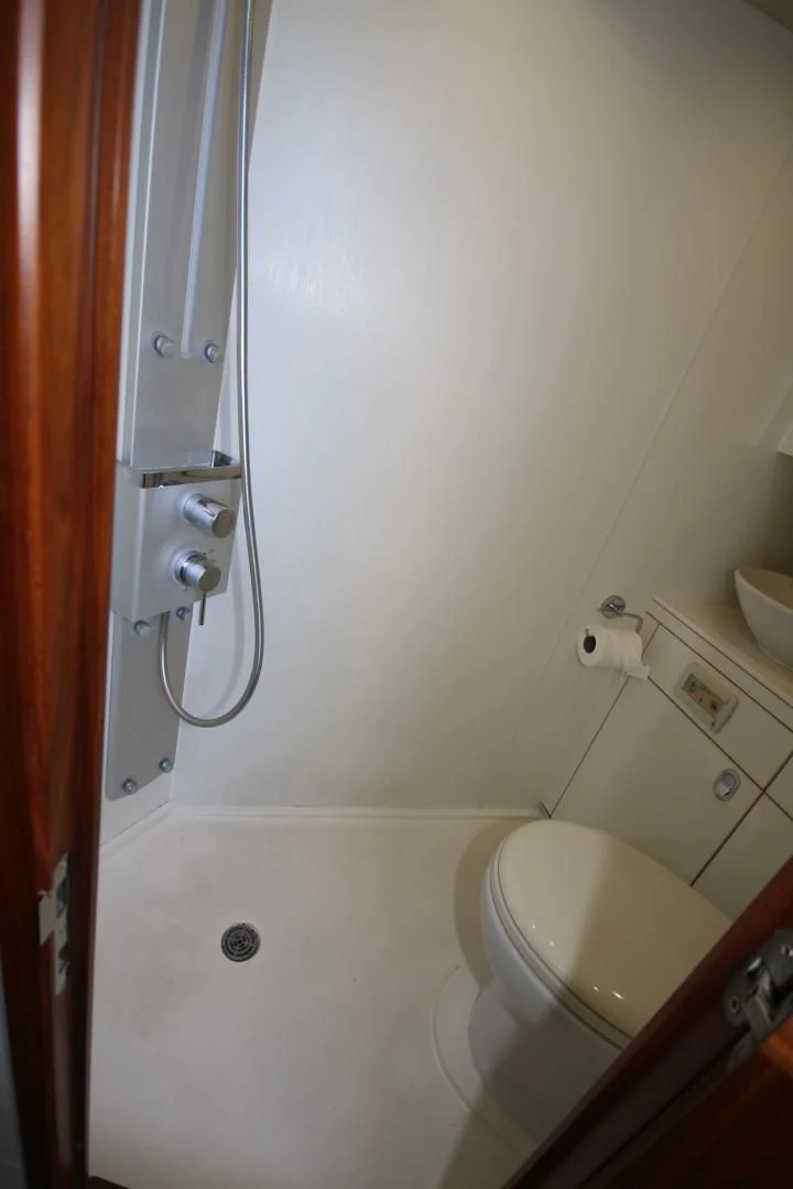 a toilet with a handle aboard SAVI II Yacht for Sale