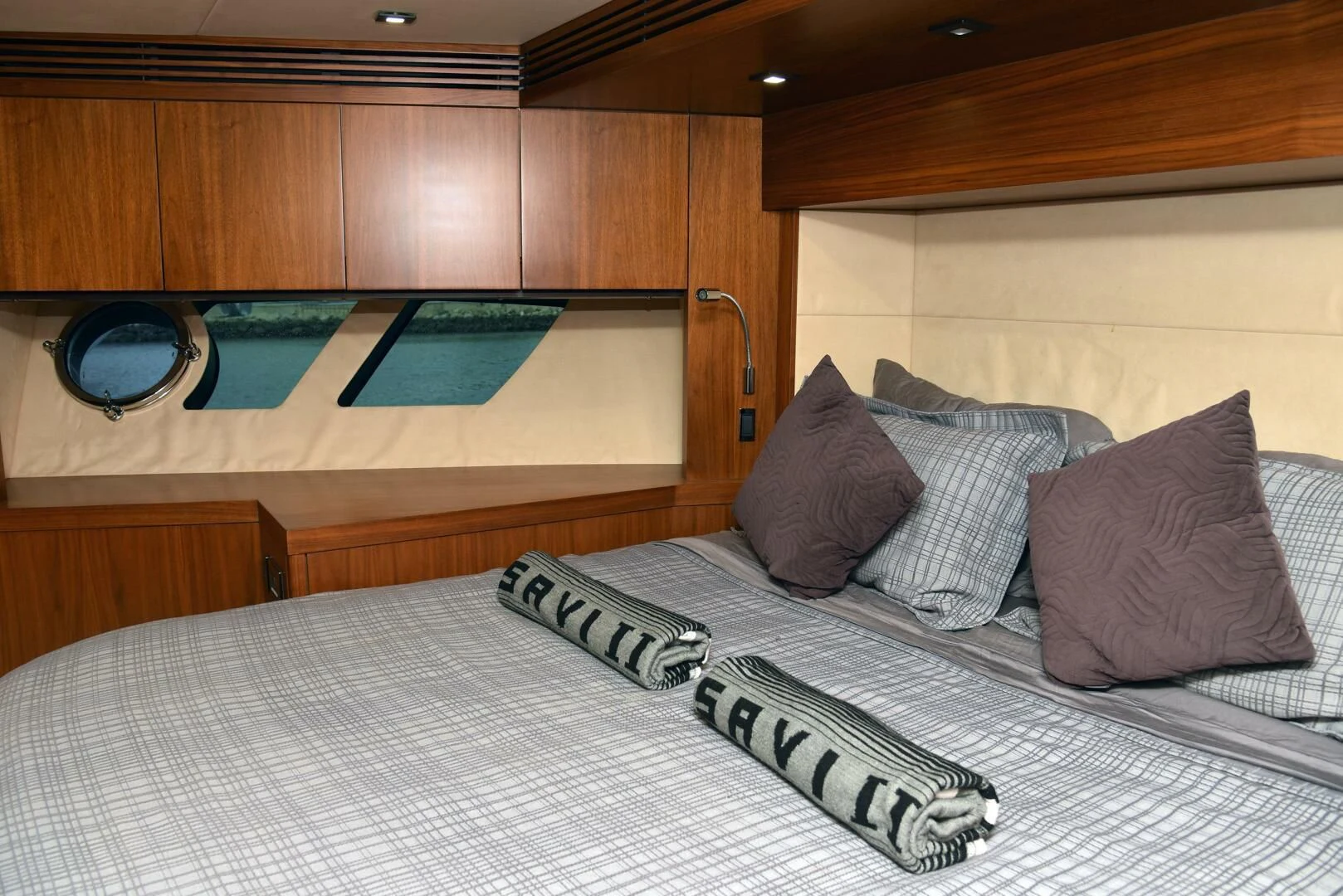 a bed with pillows aboard SAVI II Yacht for Sale
