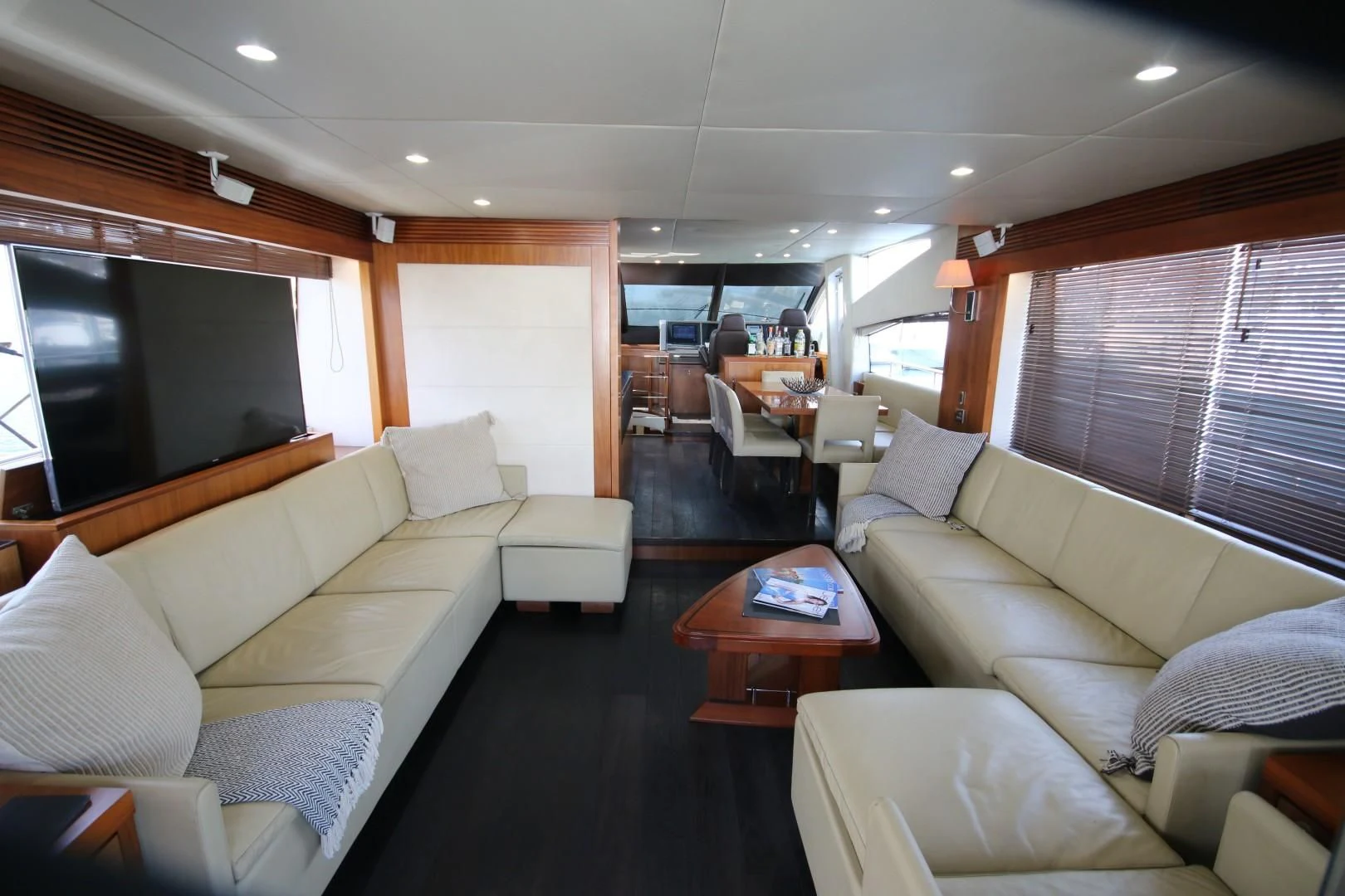 a living room with a couch and a table aboard SAVI II Yacht for Sale