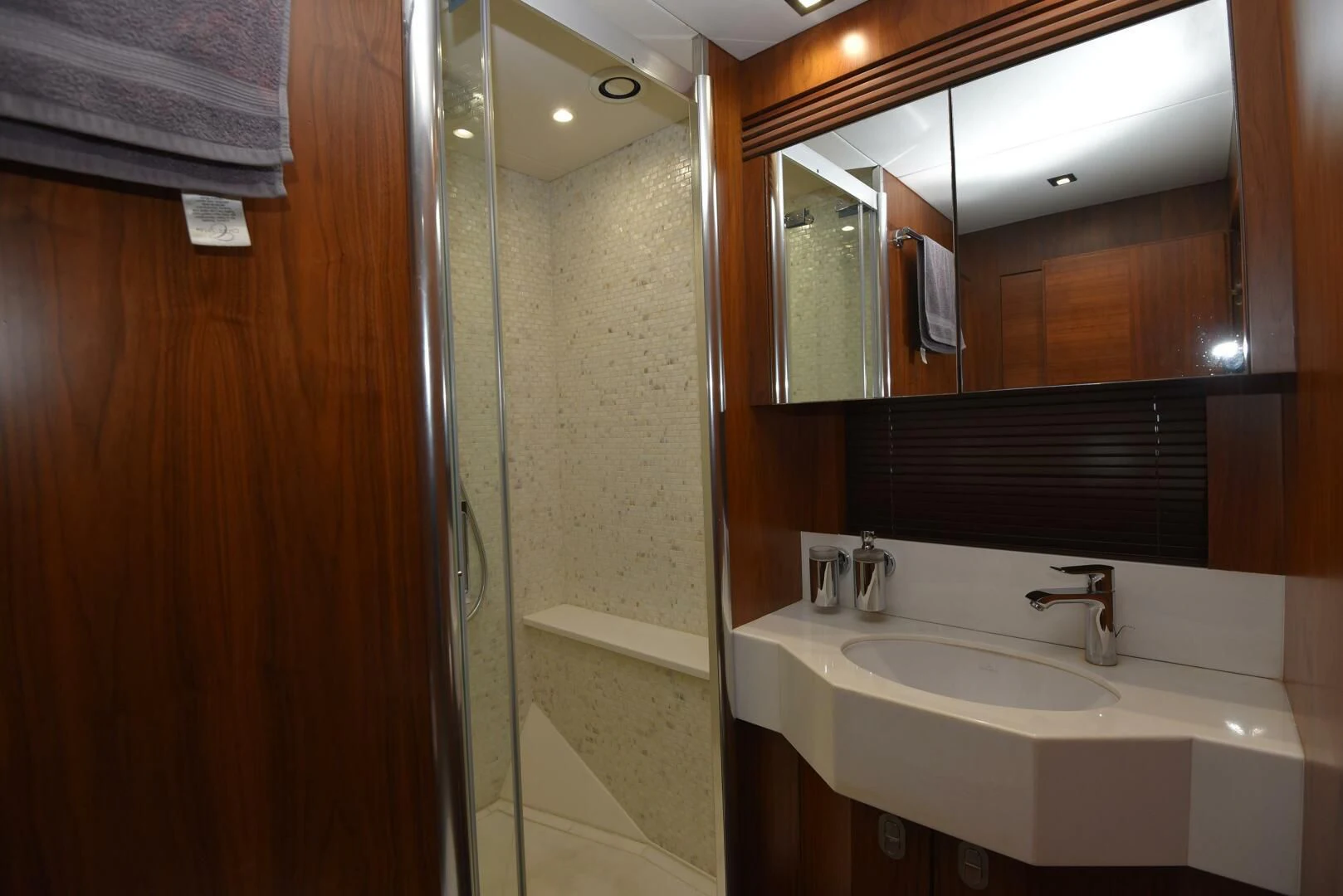 a bathroom with a sink and a shower aboard SAVI II Yacht for Sale