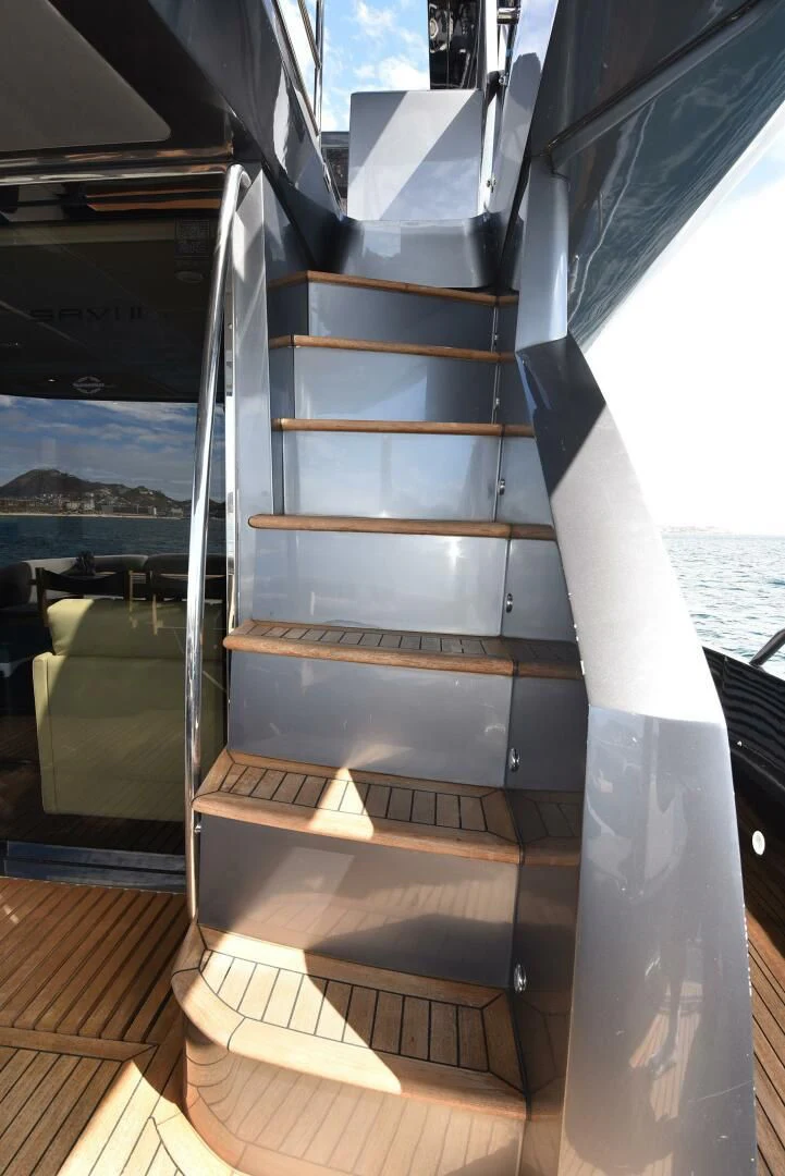 a staircase with a glass window aboard SAVI II Yacht for Sale