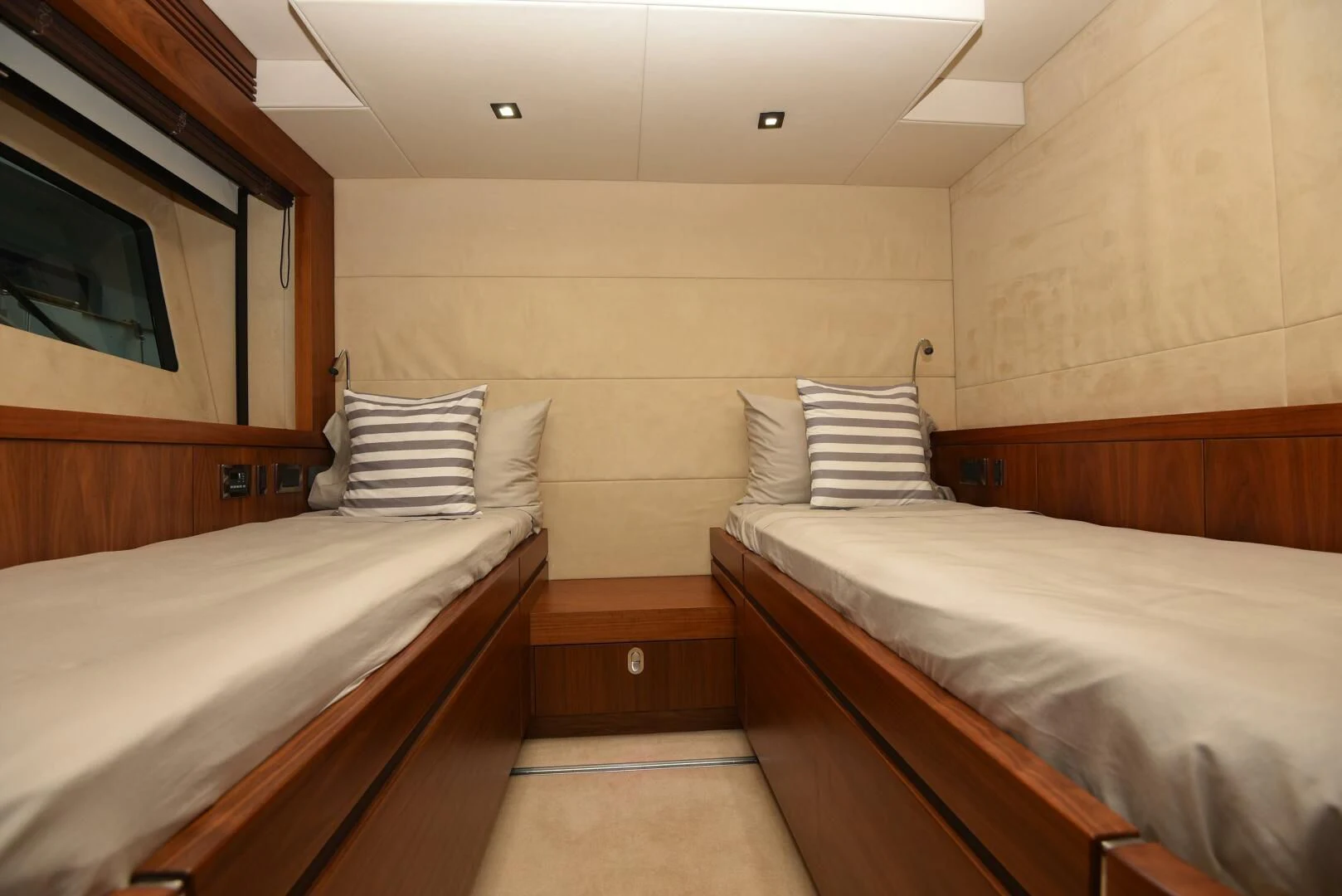 a room with two beds aboard SAVI II Yacht for Sale