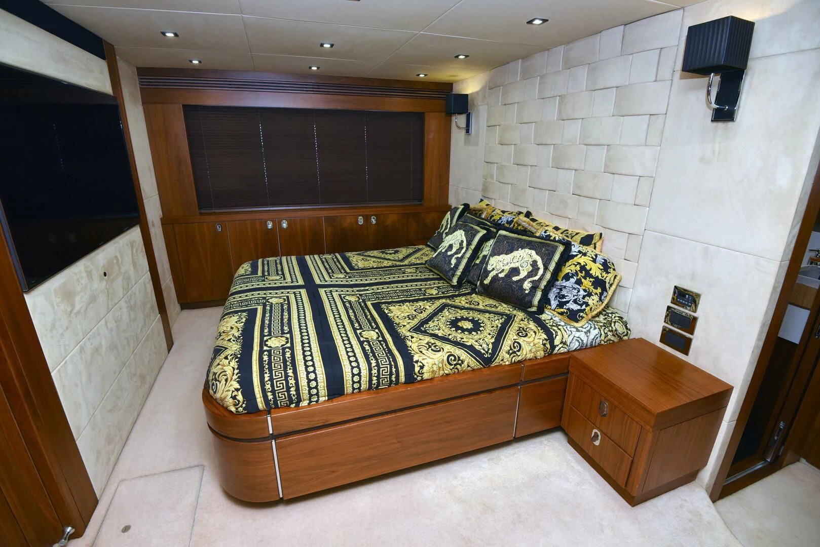 a bed in a room aboard SAVI II Yacht for Sale