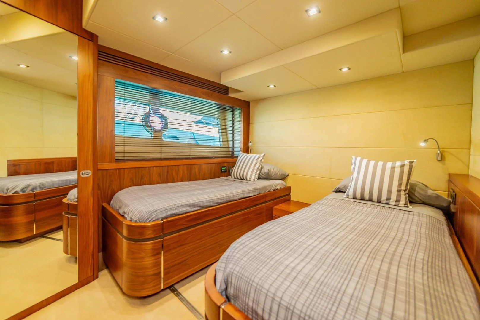 a bedroom with a bed and a television aboard SAVI II Yacht for Sale