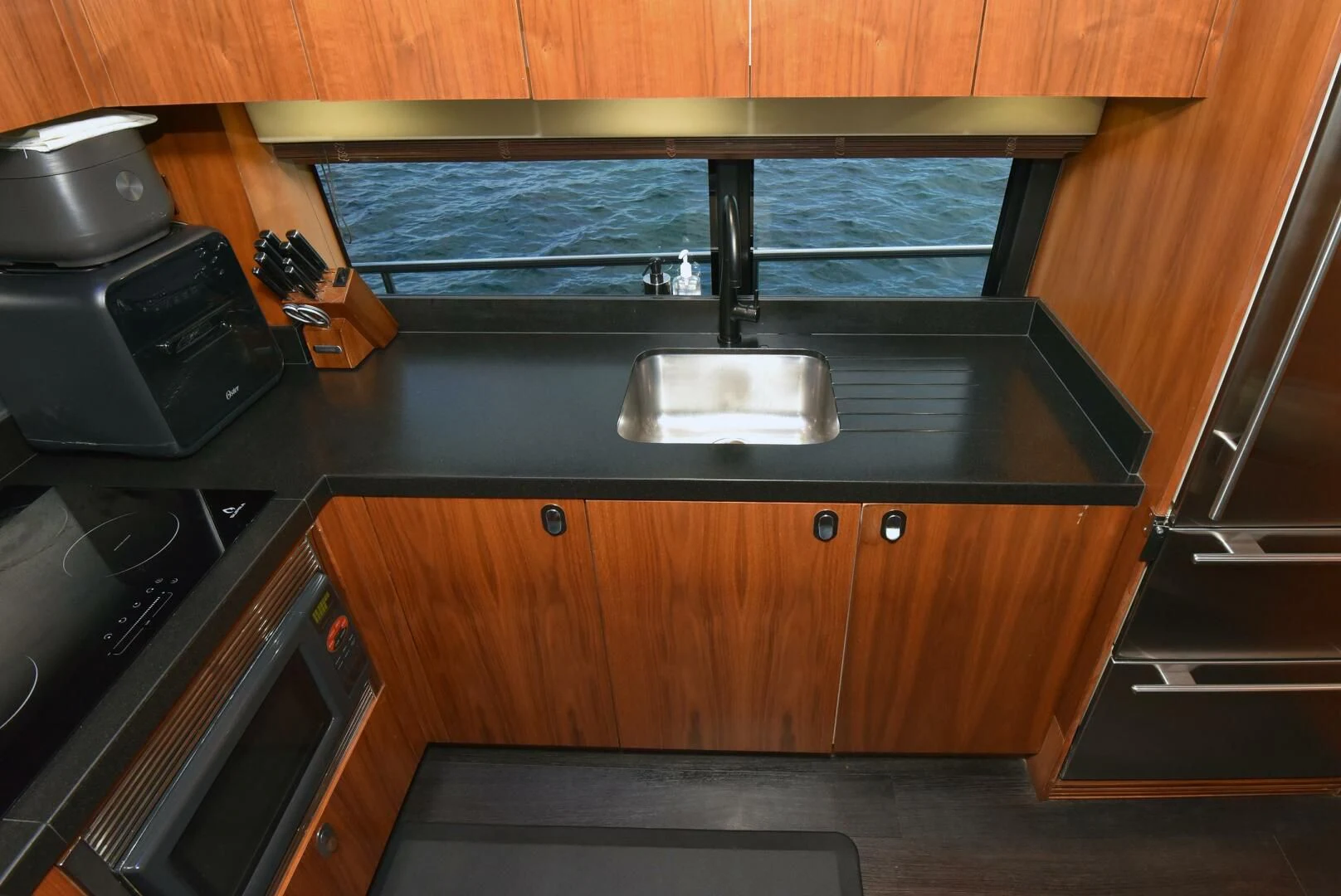 a kitchen with a sink and a stove aboard SAVI II Yacht for Sale