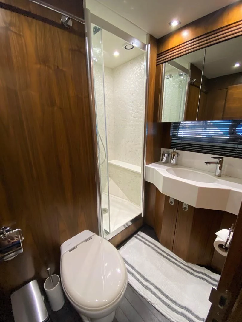 a bathroom with a shower and sink aboard SAVI II Yacht for Sale