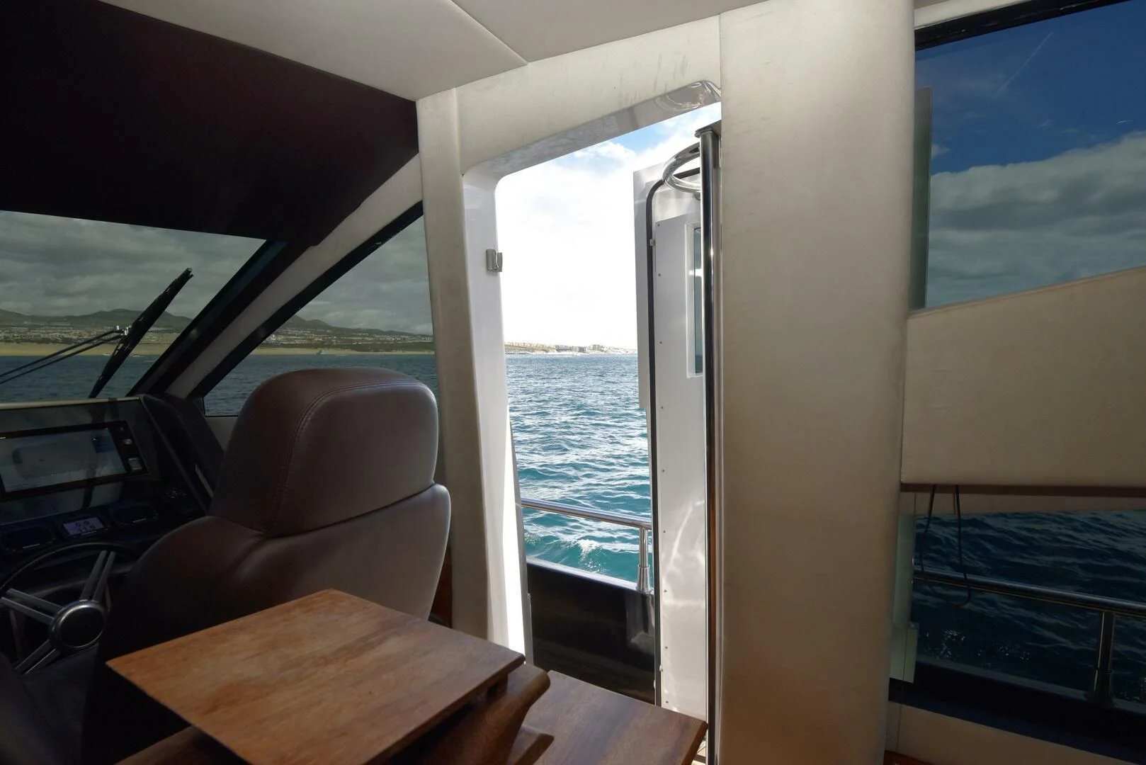 a room with a table and chairs aboard SAVI II Yacht for Sale