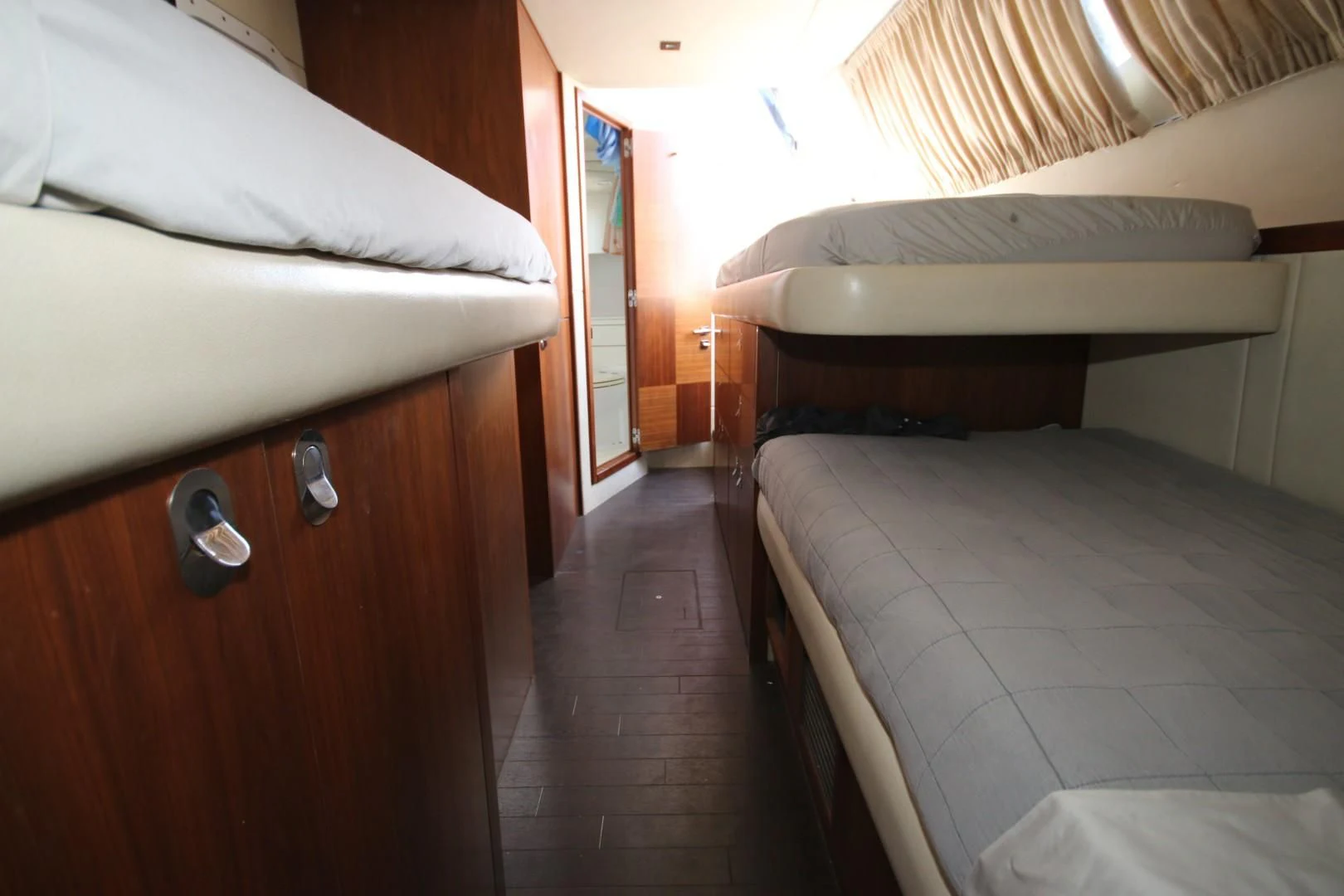 a room with two beds aboard SAVI II Yacht for Sale